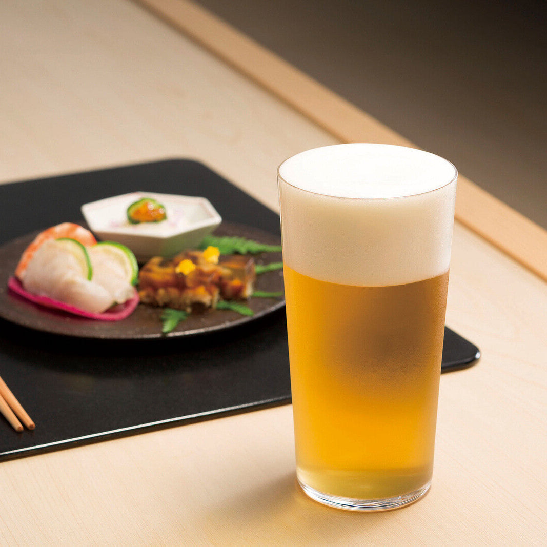 Toyo-Sasaki Tall Glass Set | Durable, Scratch-Resistant, Made in Japan tumbler filled with beer, served alongside Japanese cuisine.