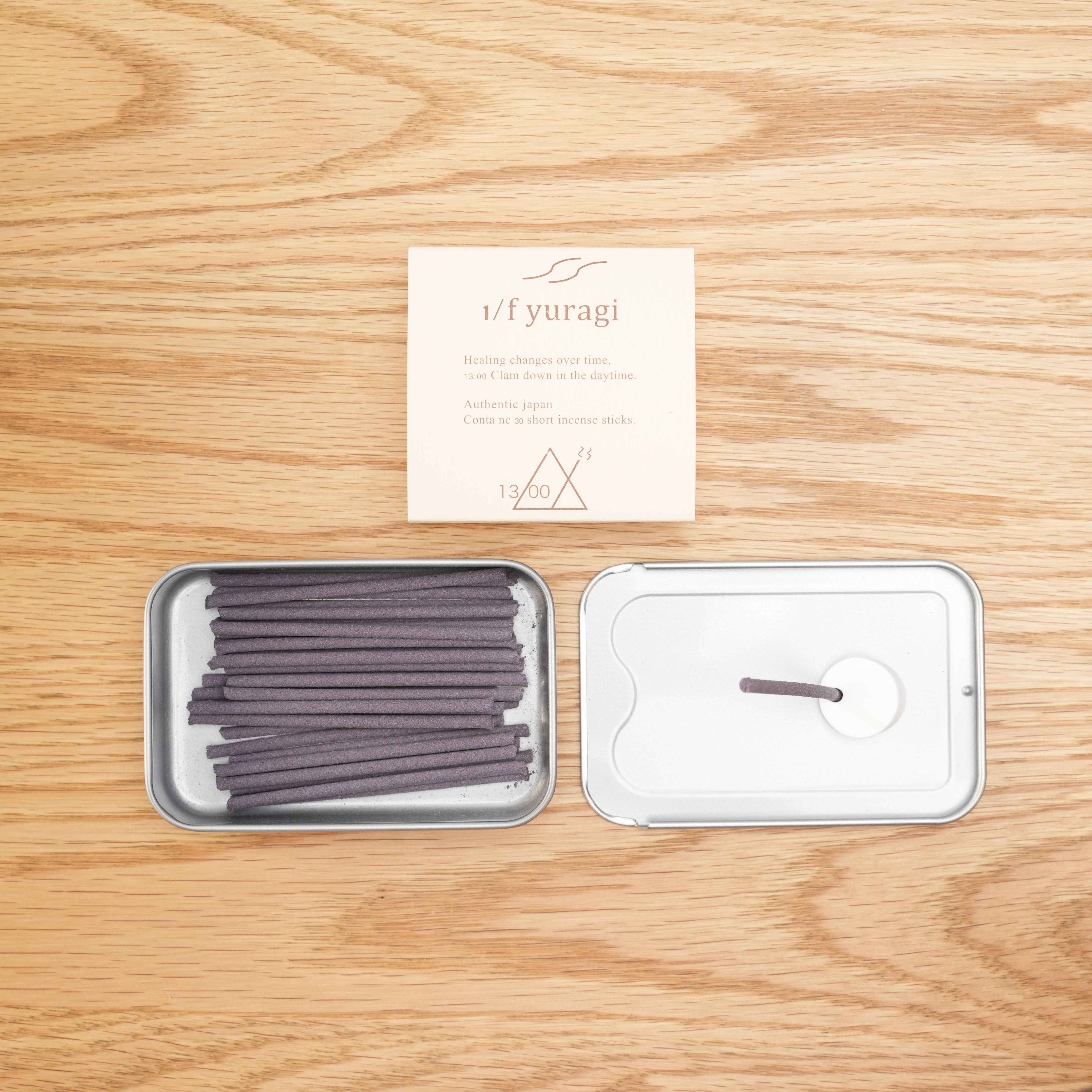 1/f Yuragi Incense 13:00 set with 30 short Japanese incense sticks and holder in open metal tin, perfect for enhancing focus and ambiance.