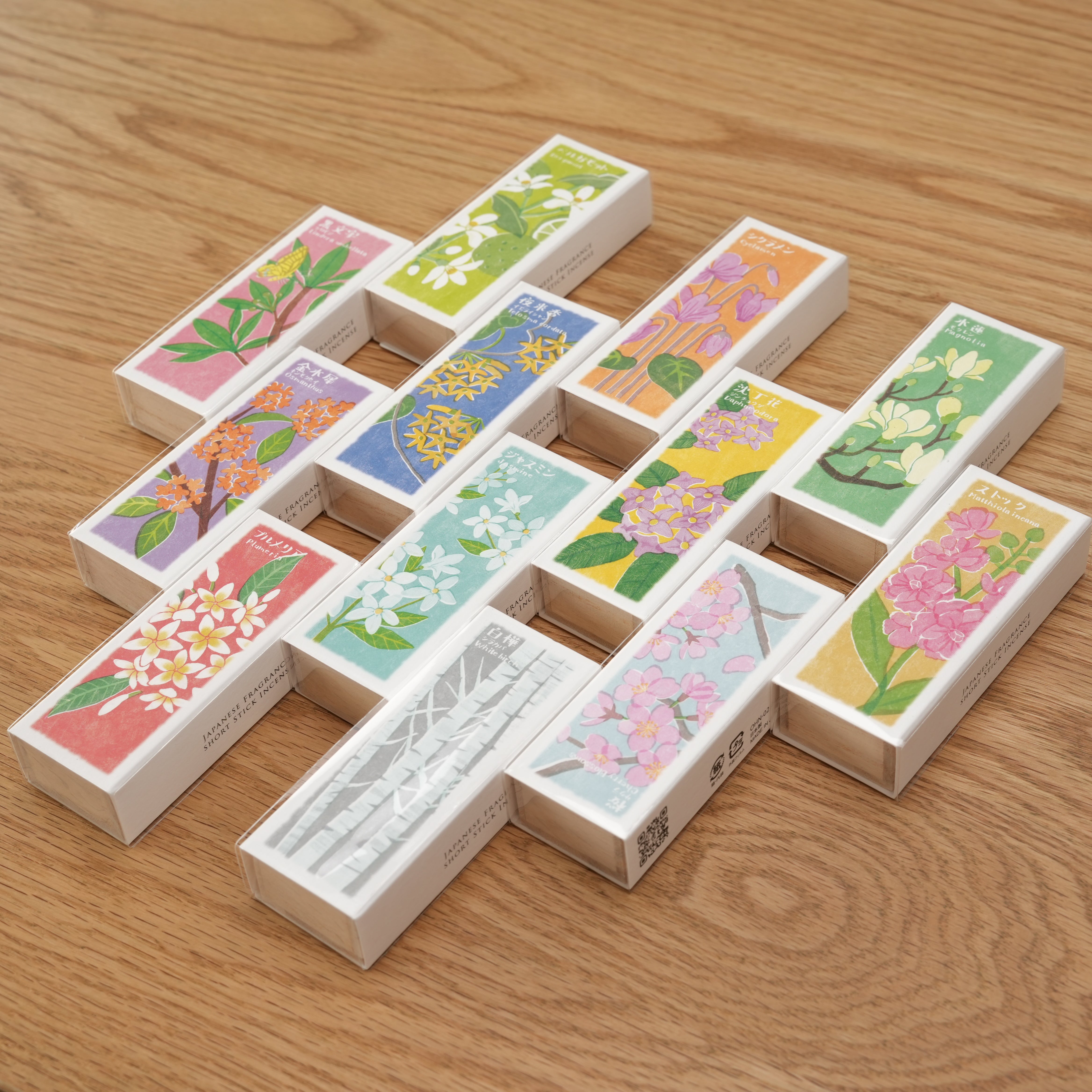 Assorted Ihana-Denshin Japanese incense boxes including Telosma cordata, showcasing vibrant floral packaging for home fragrance variety.