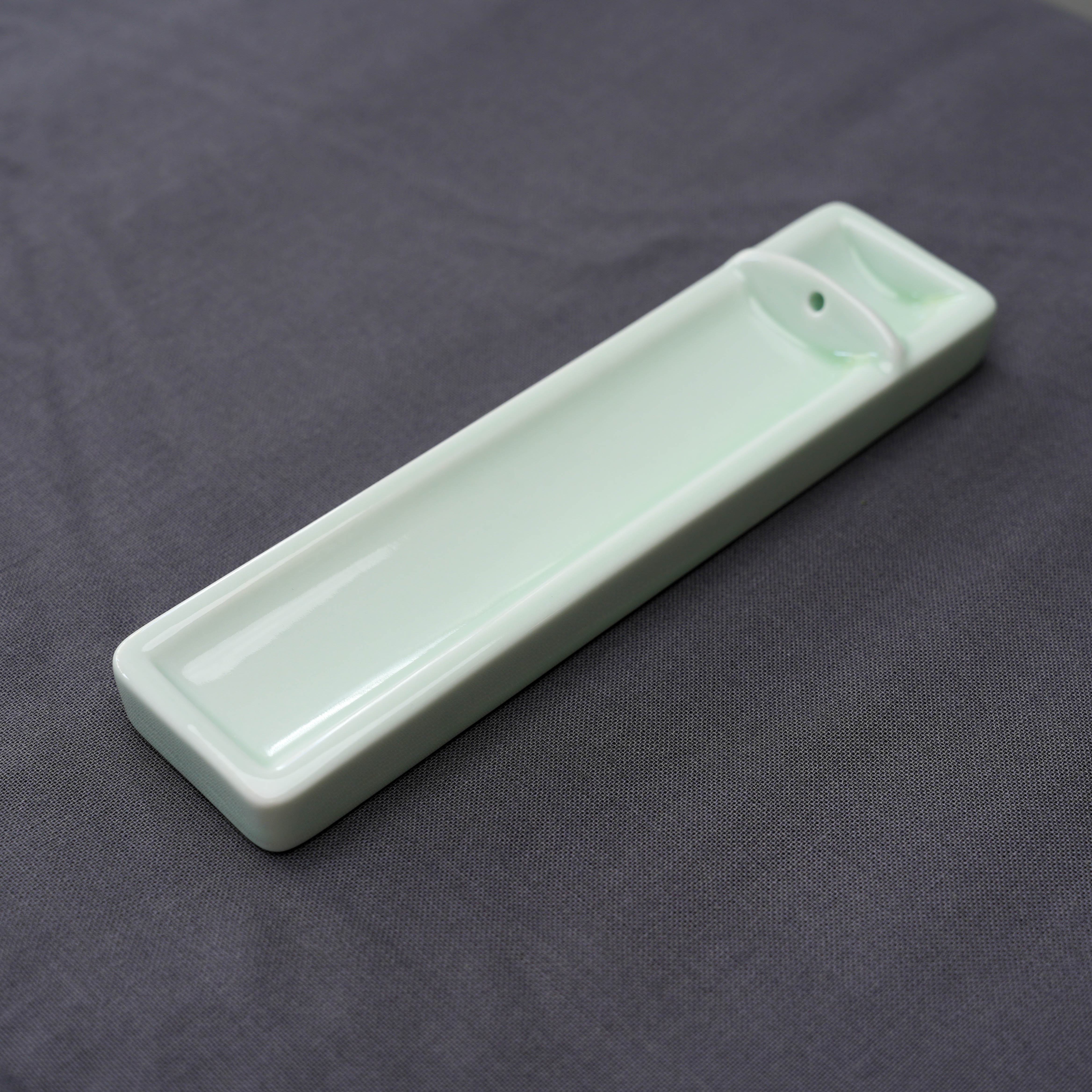Kosaido Long Incense Holder in light green porcelain with a minimalist rectangular design, ideal for modern home fragrance decor.