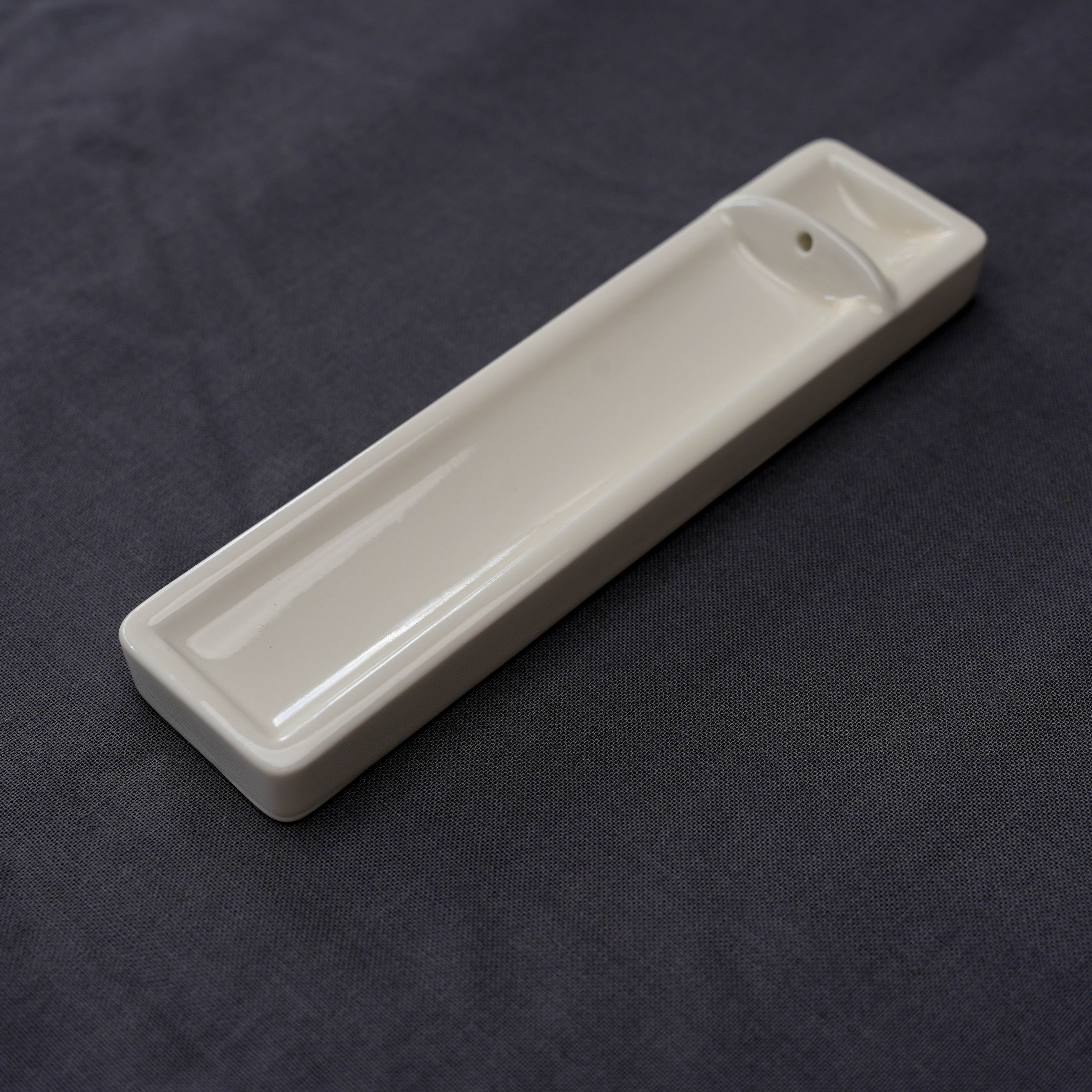 Kosaido Long Incense Holder in ivory porcelain, featuring a smooth finish and compact form for elegant incense burning in home settings.