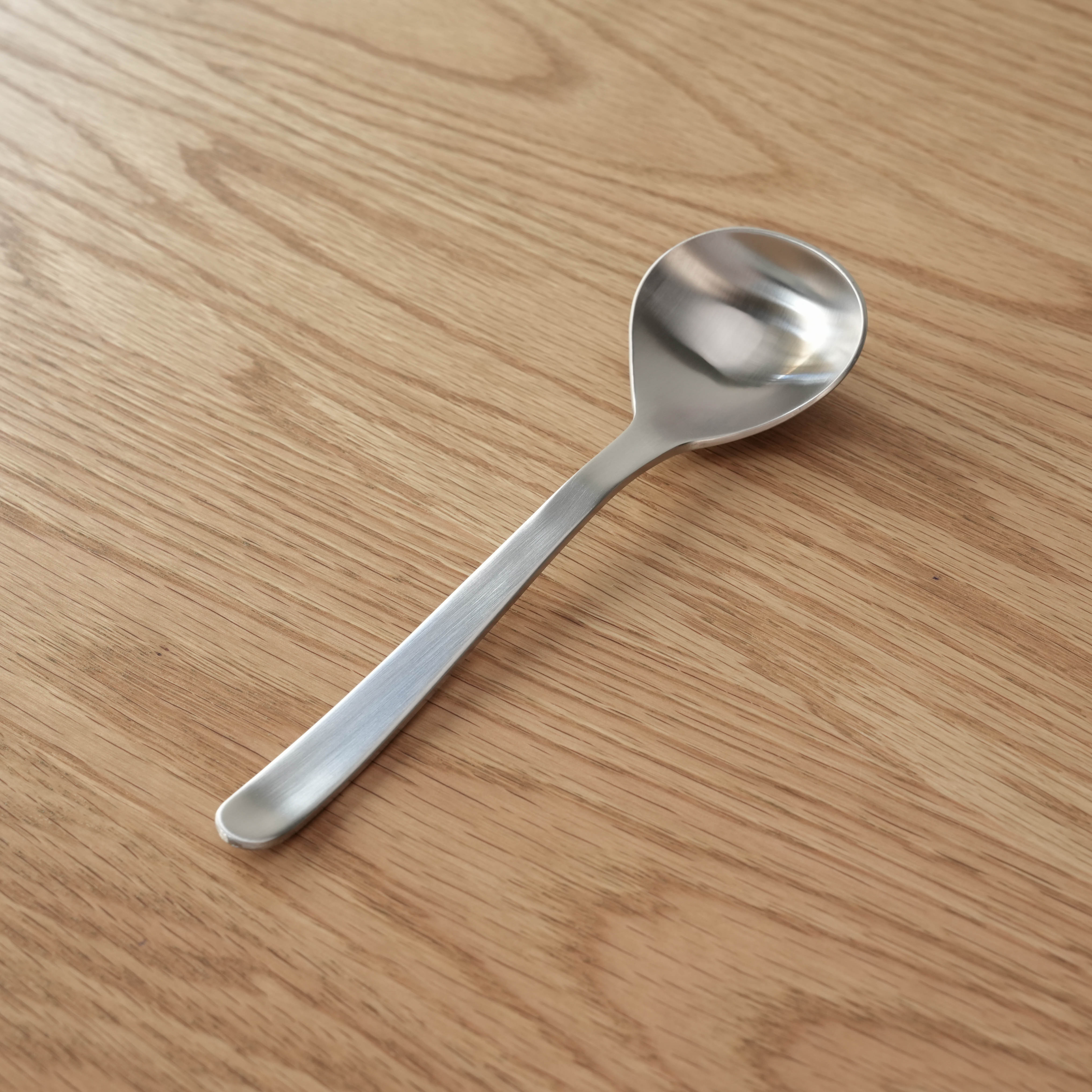 Sori Yanagi Stainless Steel Spoon with elegant curved handle. Ideal for soups, crafted in Japan with durable 18-8 stainless steel.