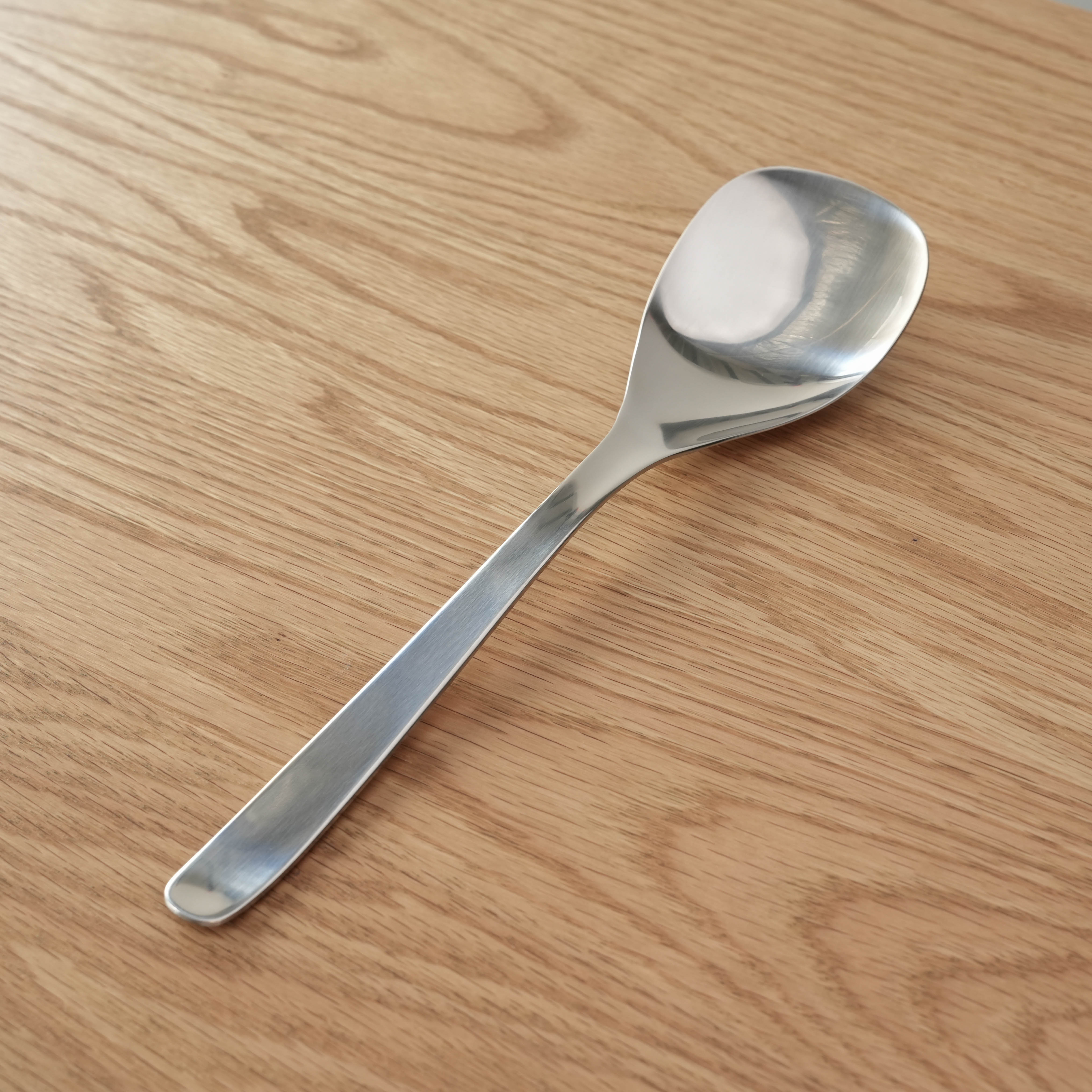 Sori Yanagi Serving Spoon in stainless steel, 24.8cm long. Ideal for stylish and balanced meal serving.