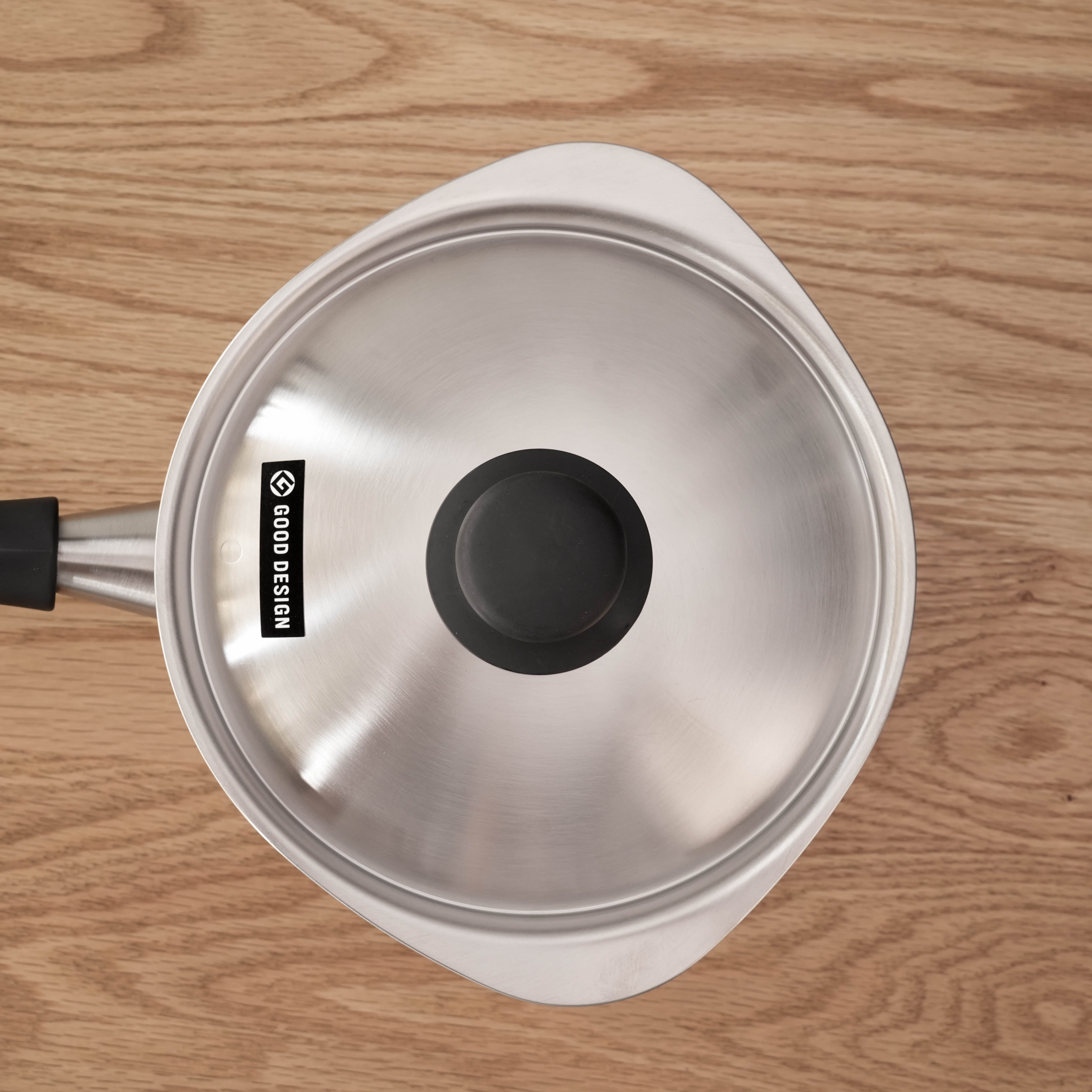 Top view of Sori Yanagi Stainless Steel Saucepan lid featuring Good Design award label, highlighting its Japanese craftsmanship.