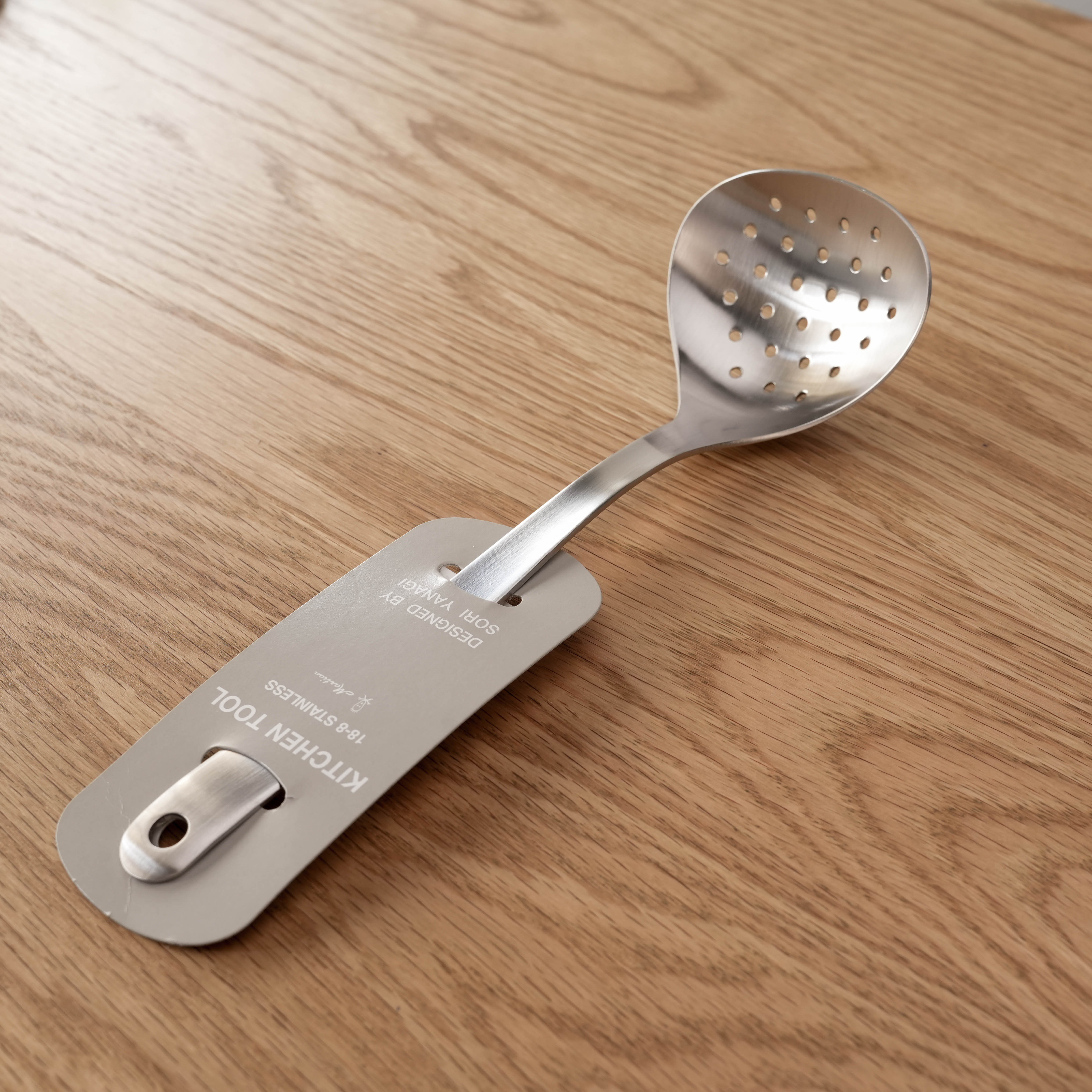 Sori Yanagi Skimmer - Stainless Steel Strainer with ergonomic handle, ideal for straining foods in modern kitchens. Japanese design kitchen utensil.
