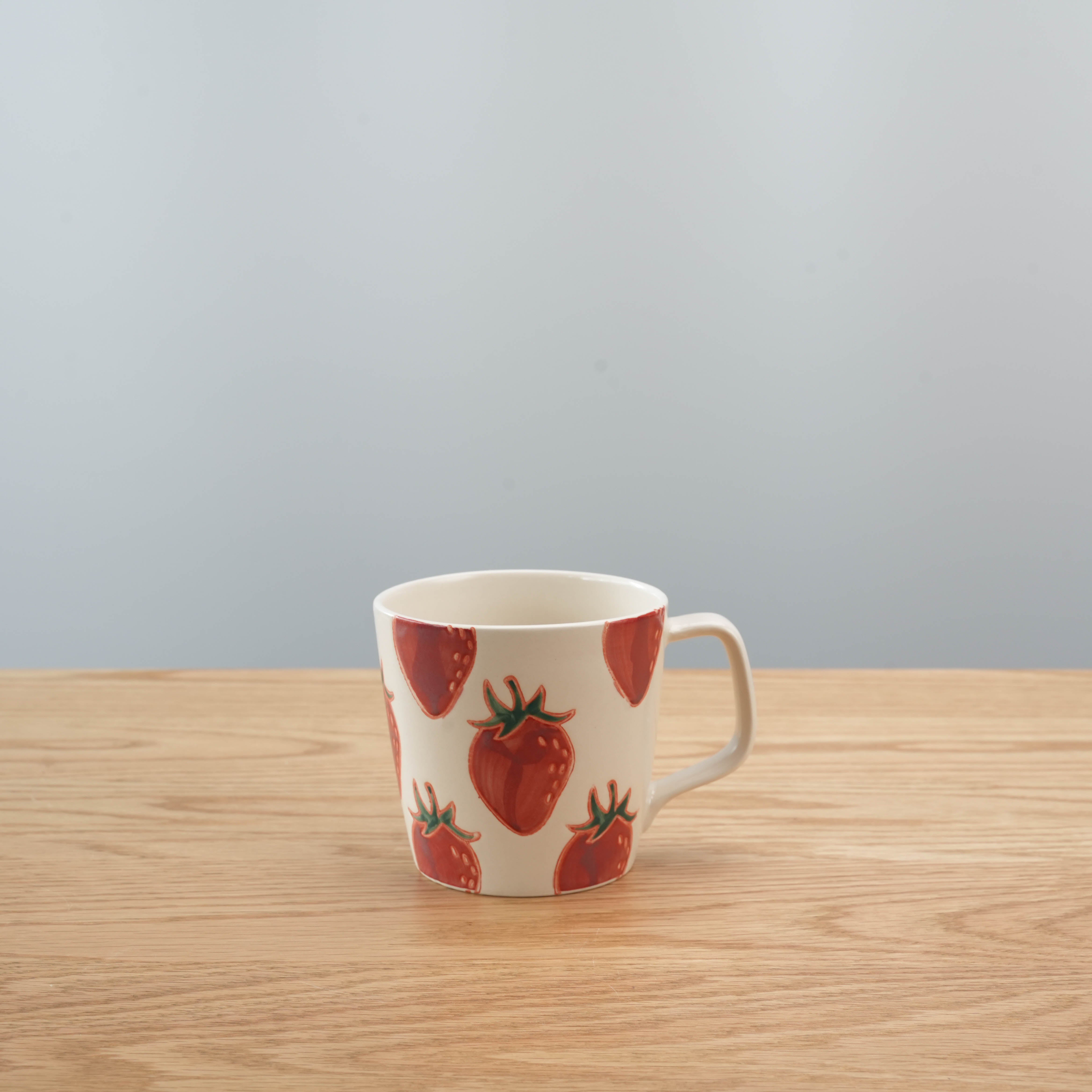 Hasami Ware Mug - Strawberry Mug with hand-painted red strawberries on cream ceramic. Japanese design perfect for kitchen or gift sets.
