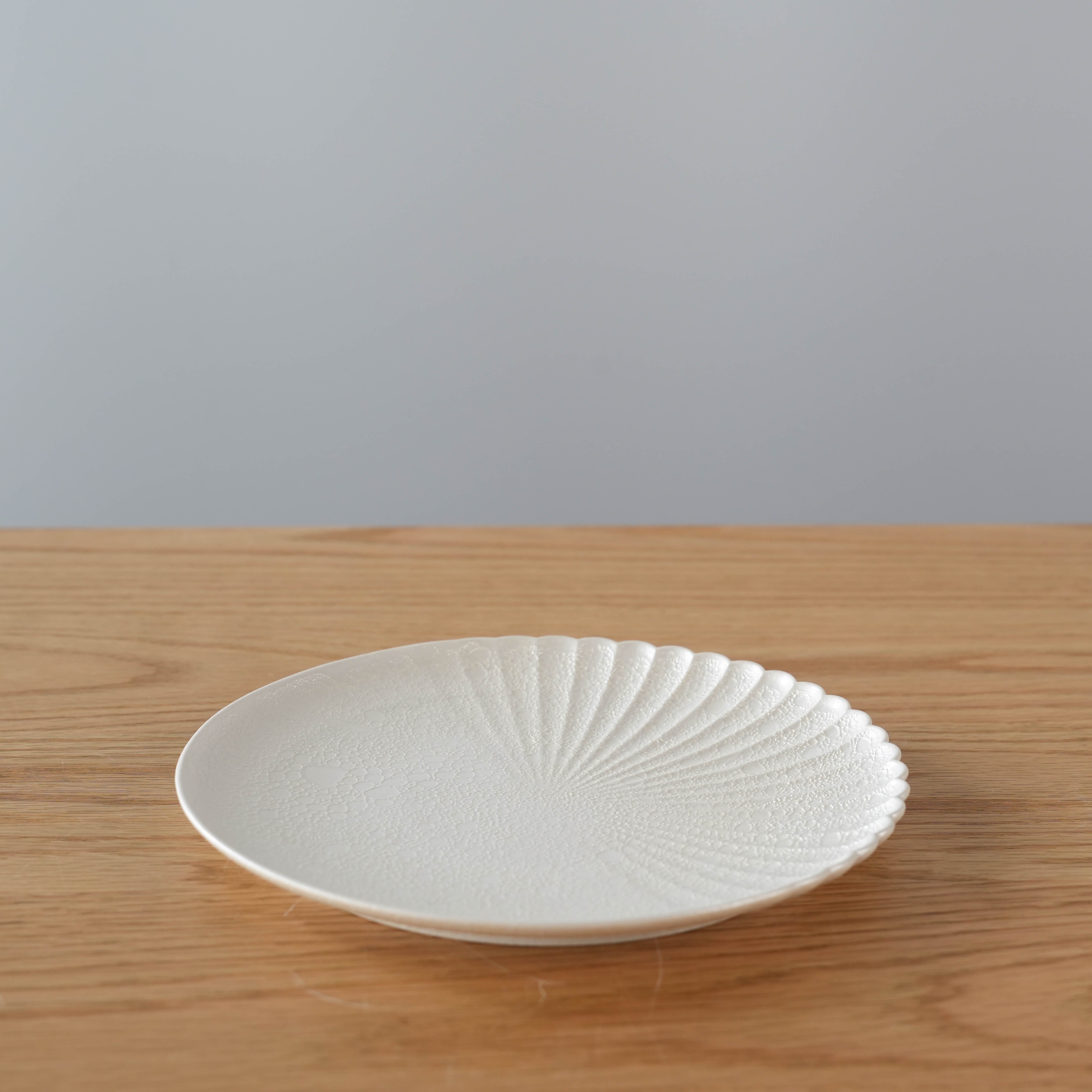 Arita Ware One Sided Chrysanthemum Carving Plate with elegant fan-like petal design, made in Japan, ideal for modern tableware collections.