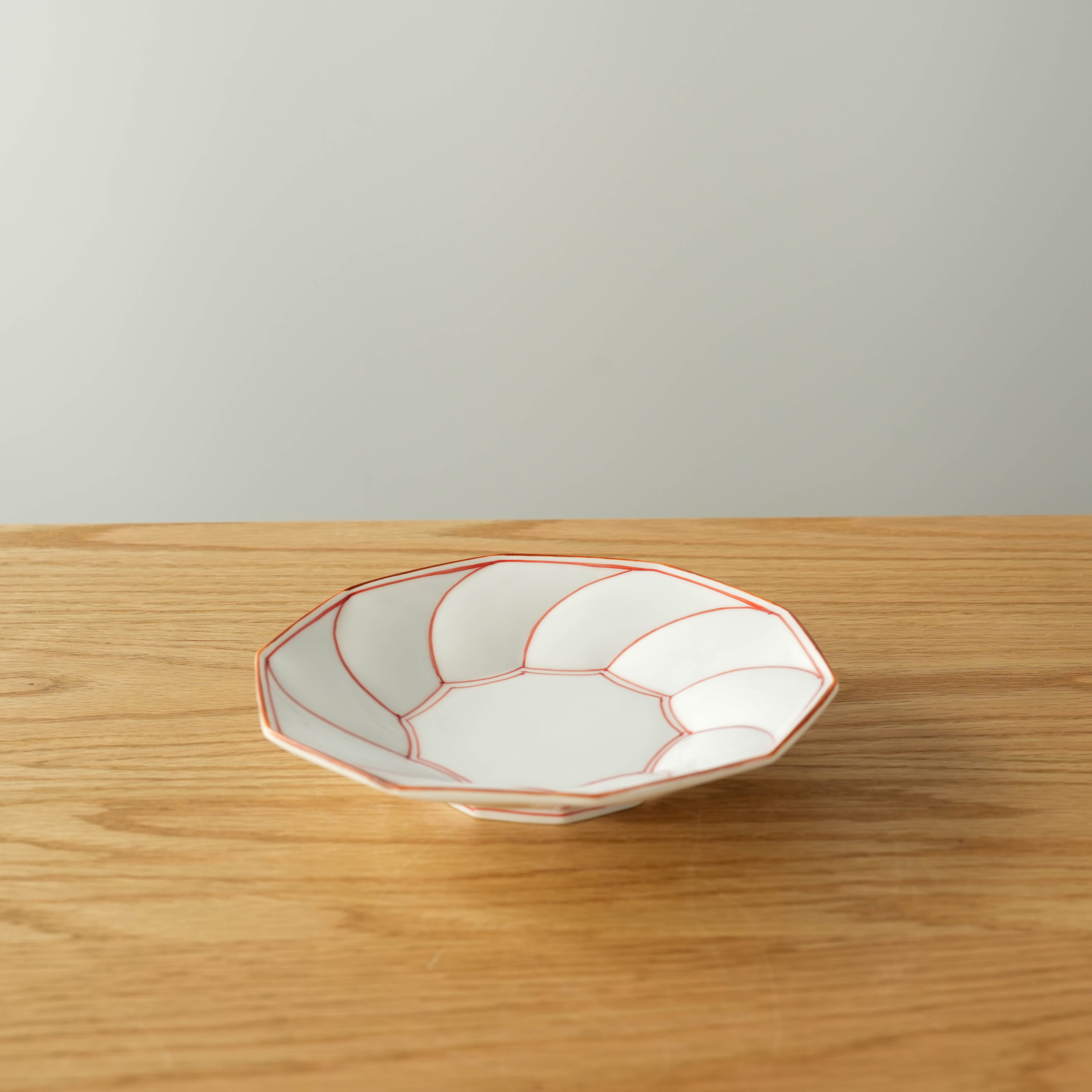 Hasami Ware Twisted Plate - Small Dish in red with Japanese design, ideal for desserts or side servings in elegant table settings.