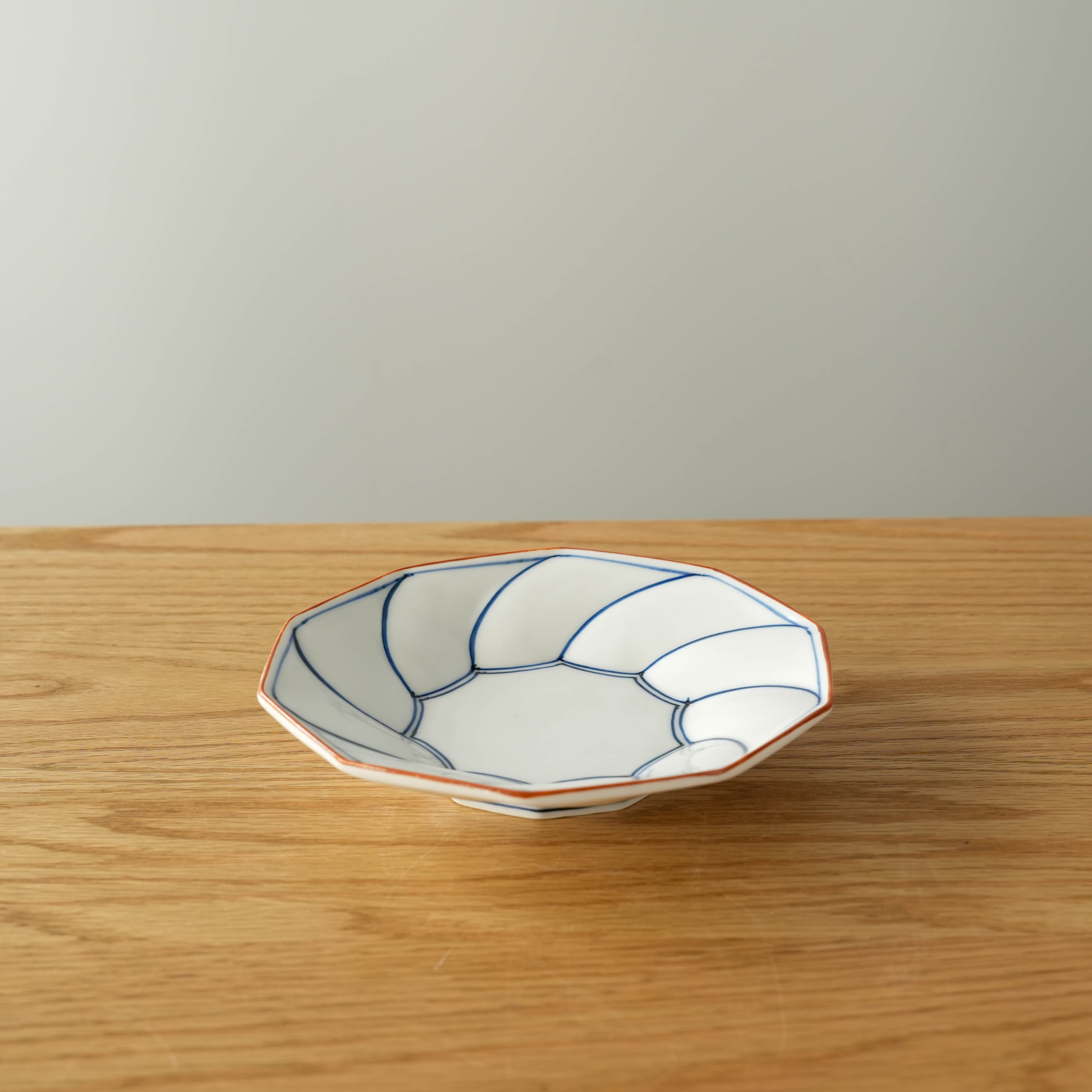 Hasami Ware Twisted Plate - Small Dish in blue, featuring traditional Japanese craftsmanship for stylish and functional dining.