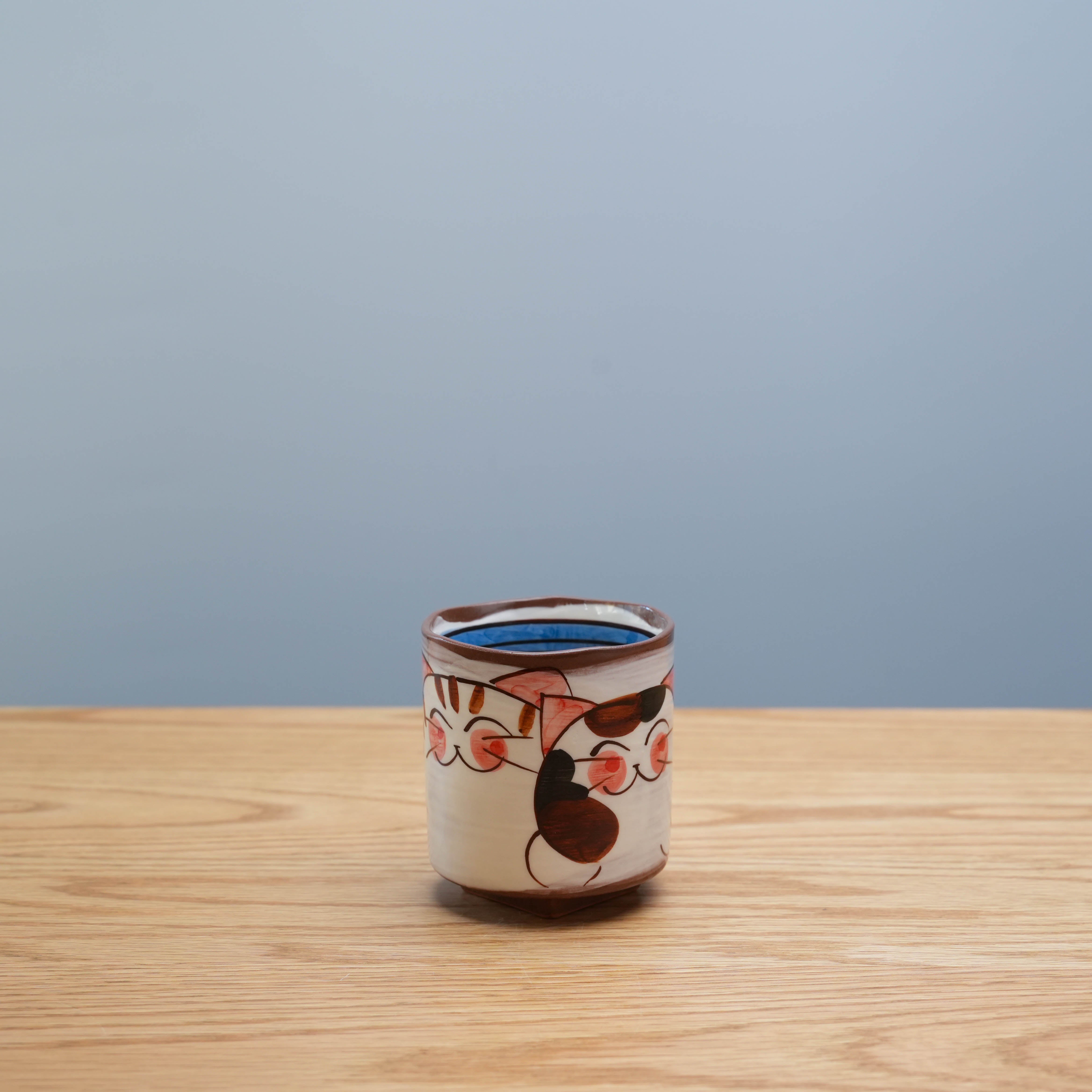 Hasami Ware Three Friendly Cat Tea Cup with Japanese design, featuring hand-painted cats and a unique square lower body, 150ml ceramic mug.