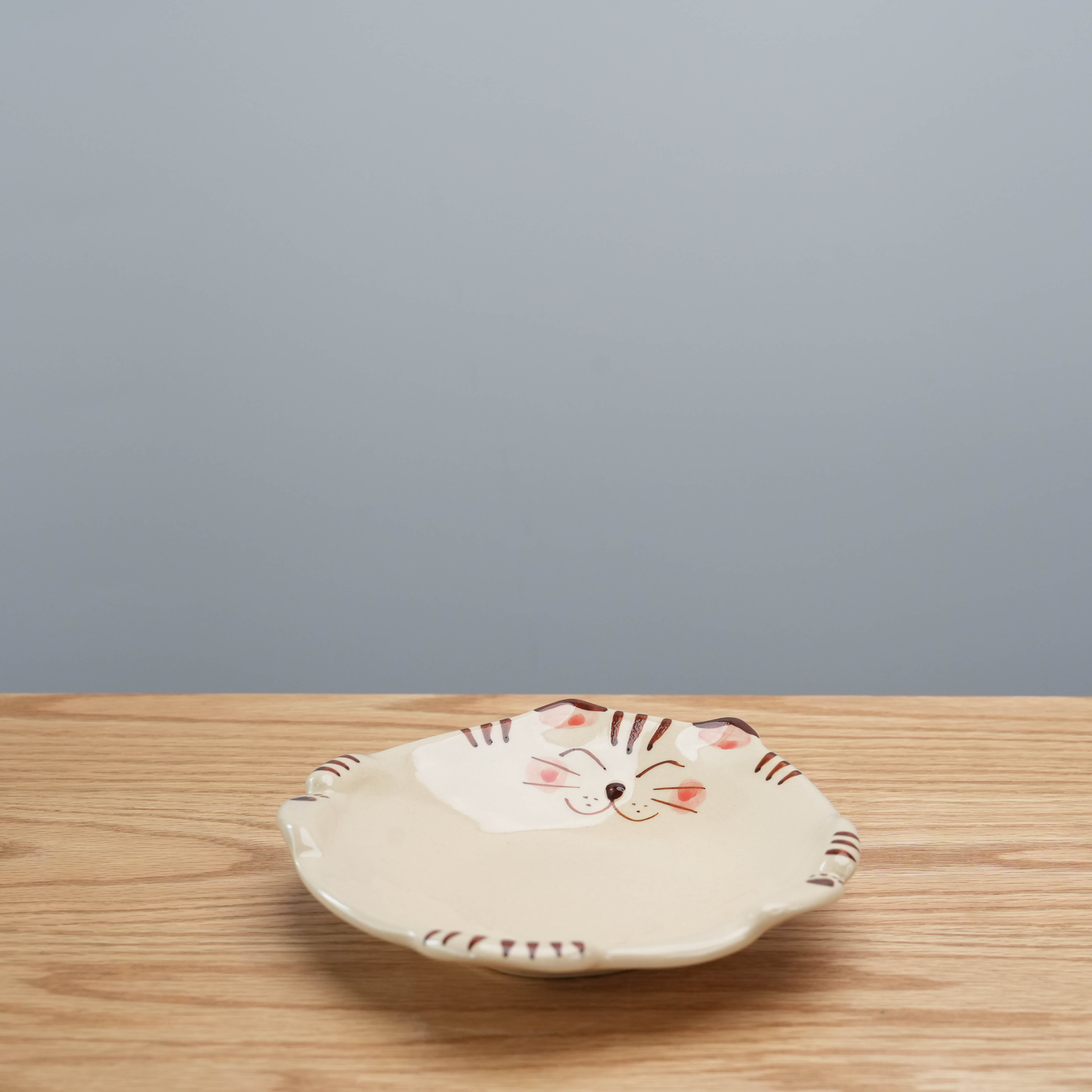 Hasami Ware Lucky Cat Plate - Tiger with artisan brushwork and smiling cat design, perfect for enhancing kitchen and dining aesthetics.