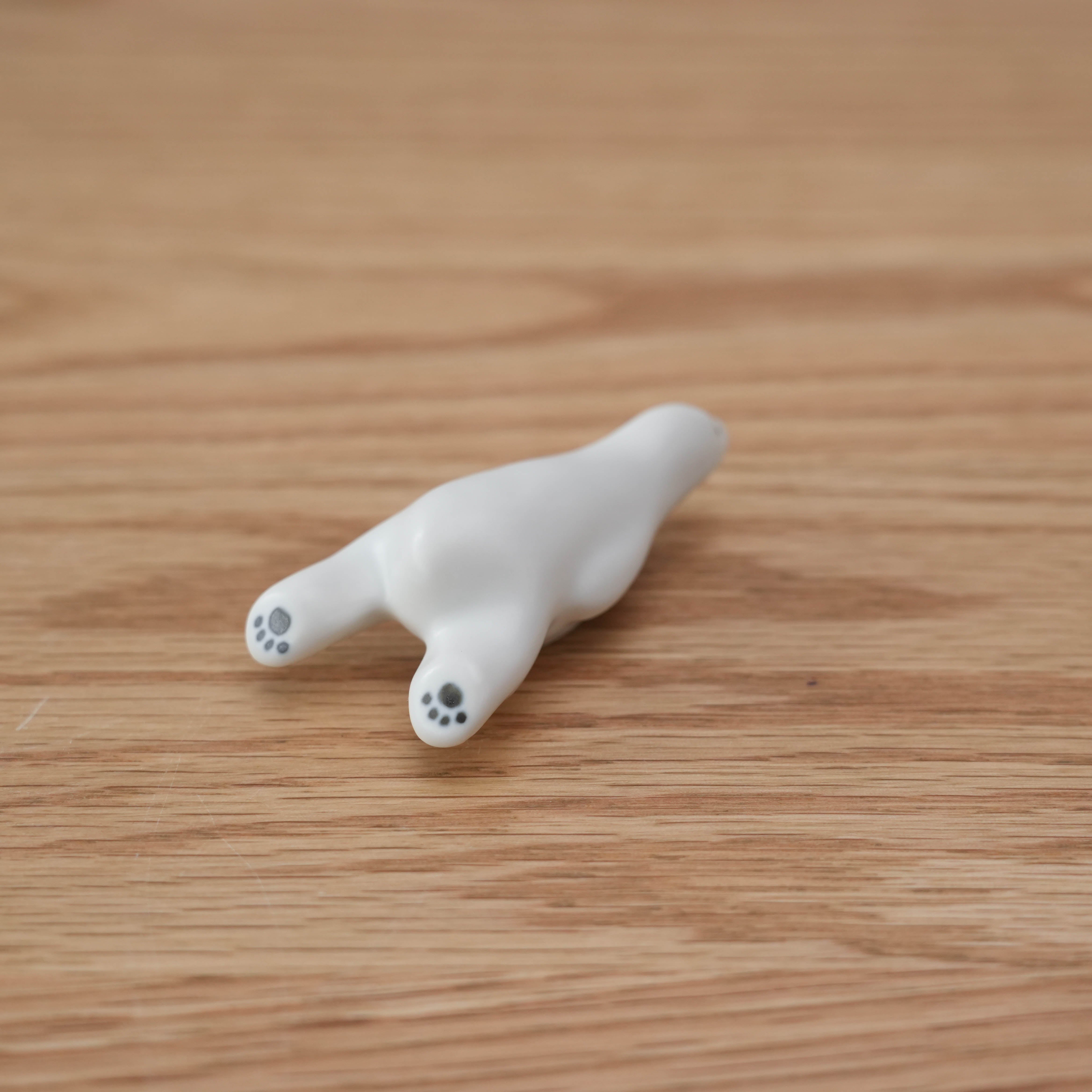 Underside view of Arita Ware Polar Bear Chopstick Rest showing detailed paw prints, crafted in Japan for refined kitchen and dining decor.