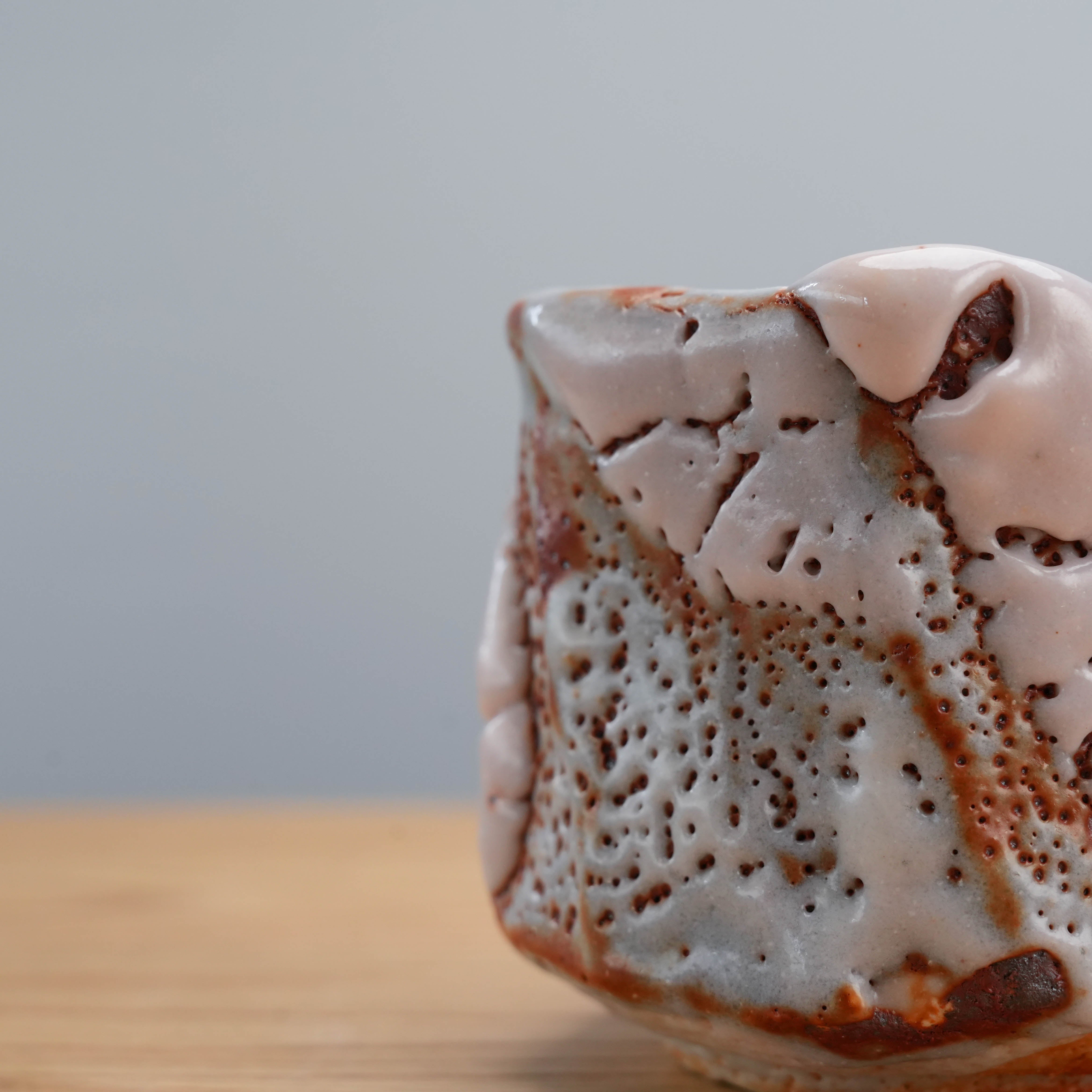 Side detail of Mino Ware Cup by Kano Shinji, showing layered Shino glaze and natural ceramic texture.