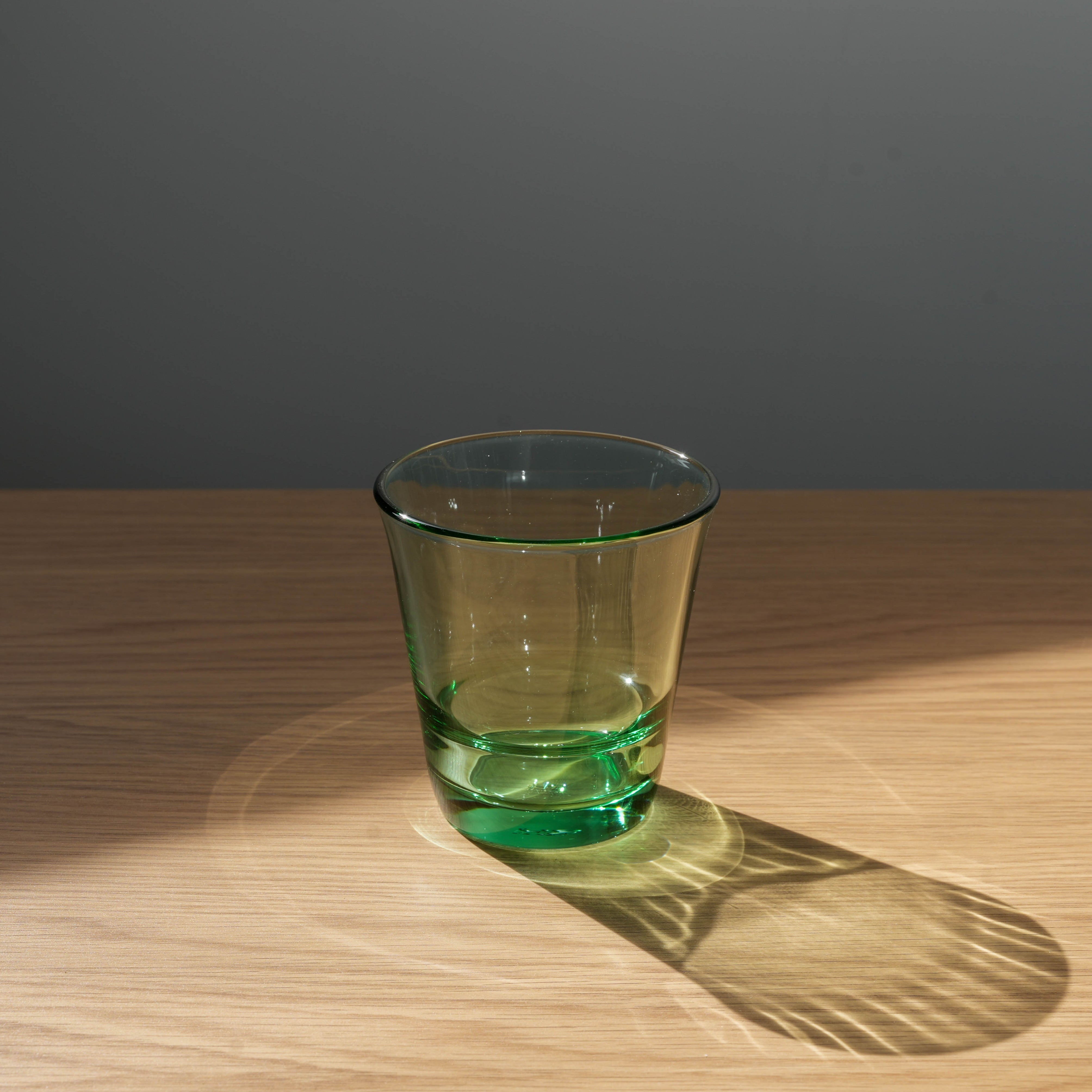 Toyo-Sasaki Splash tumbler in green glass, stackable and durable Japanese drinkware ideal for modern kitchens and cafes.