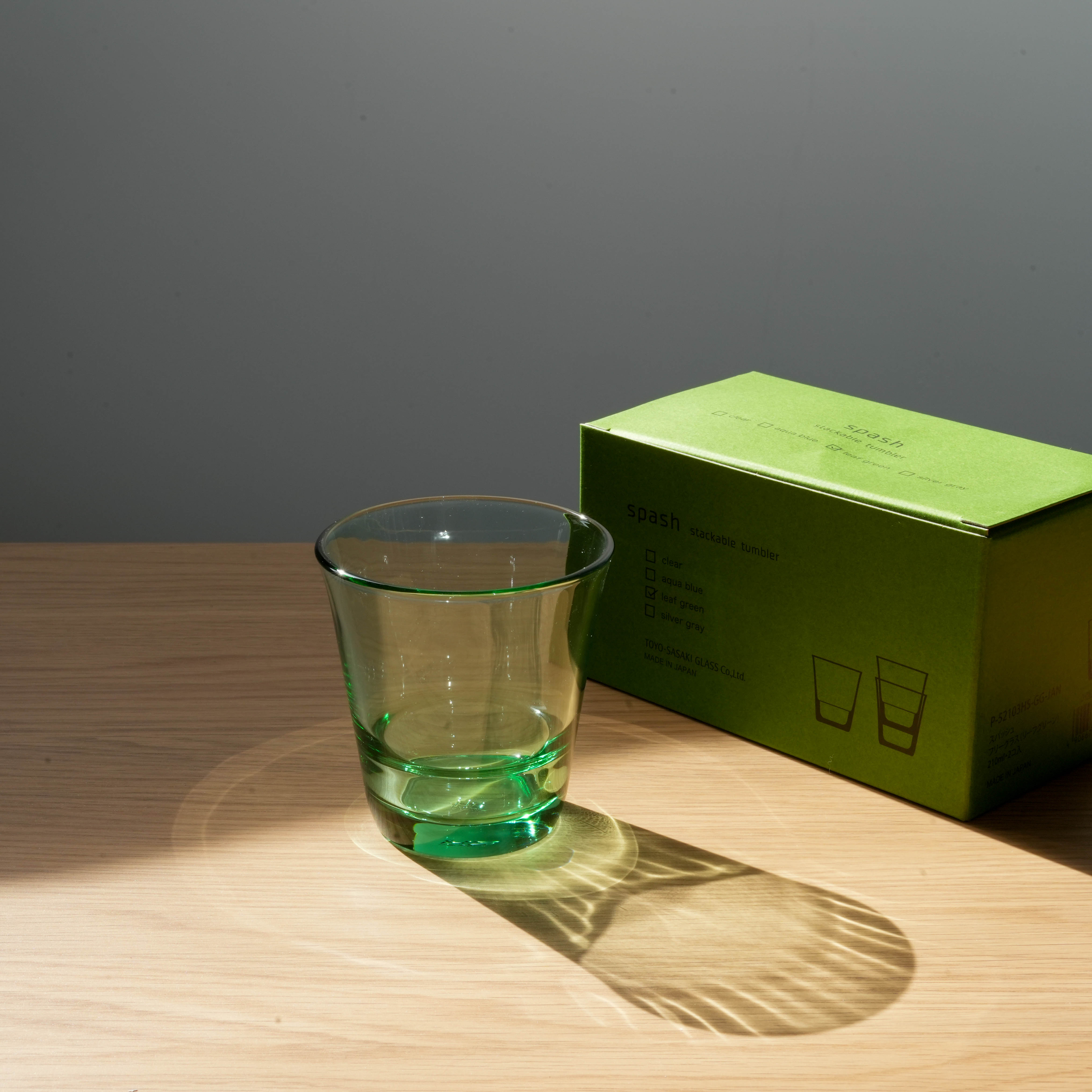 Green Toyo-Sasaki Splash tumbler with matching box, showcasing stylish and stackable Japanese glassware for kitchen or dining use.