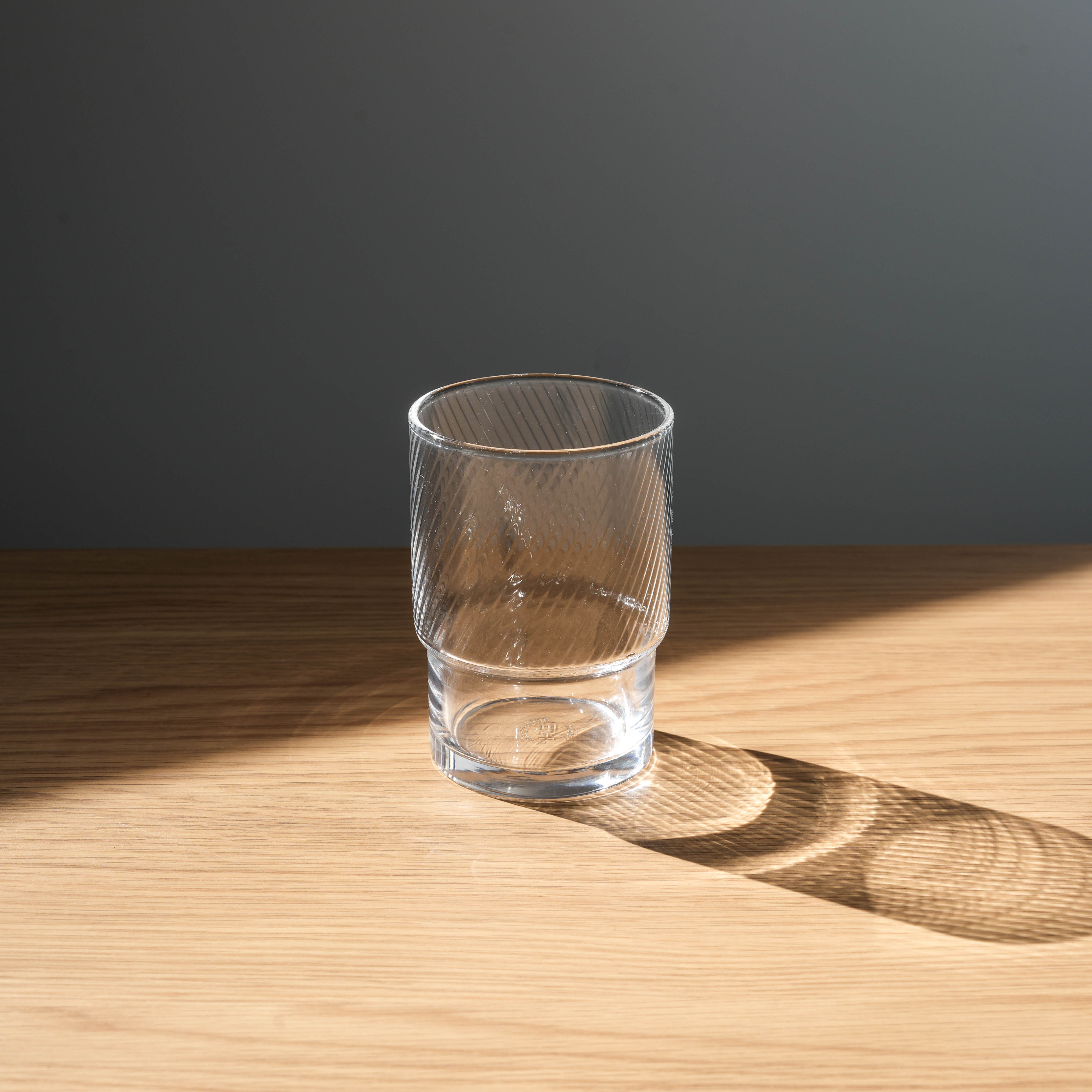 Clear Toyo-Sasaki stackable tumbler with HS toughened glass, ideal for modern kitchens and drinkware collections.