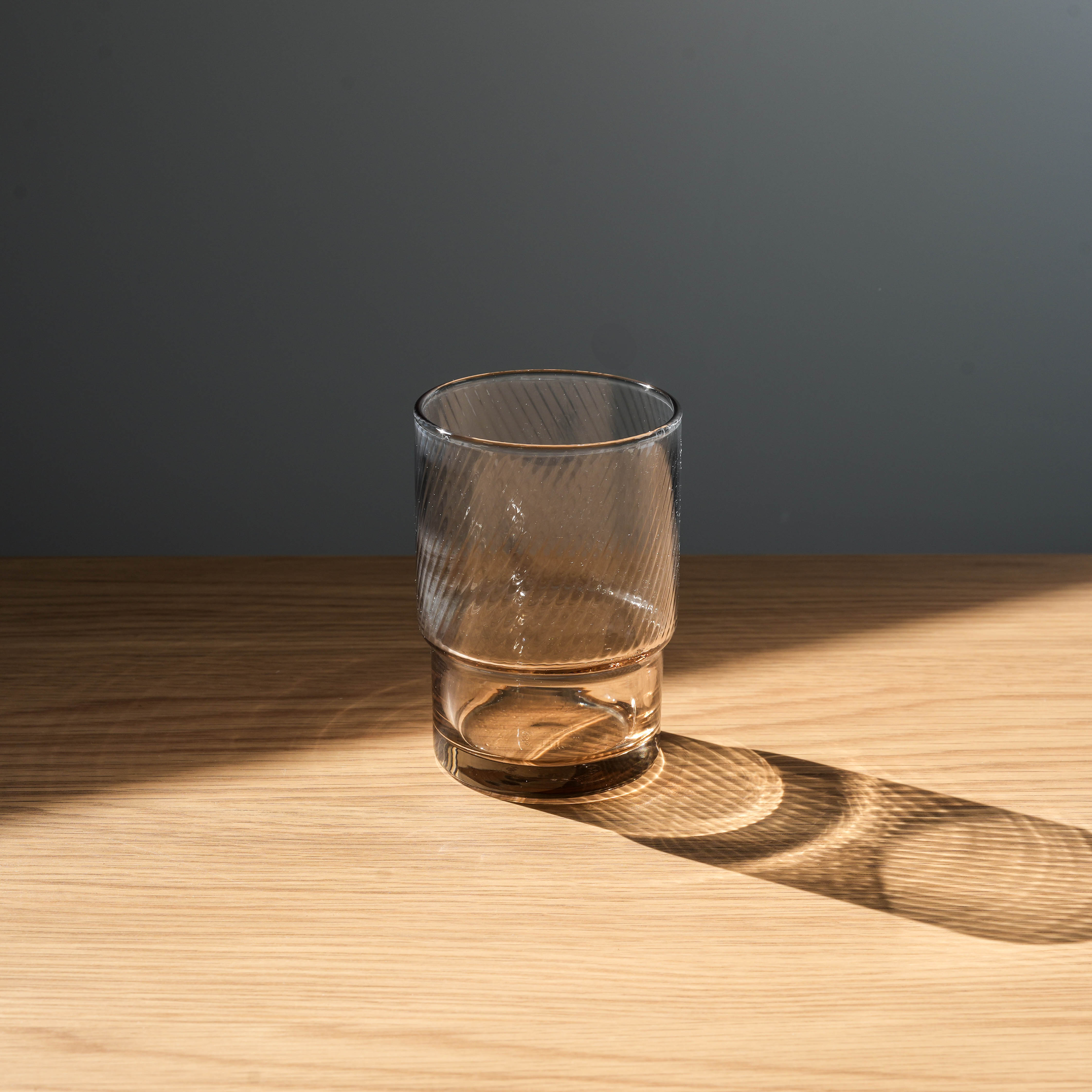 Amber-toned Toyo-Sasaki stackable tumbler featuring durable HS glass, perfect for stylish and functional tableware.