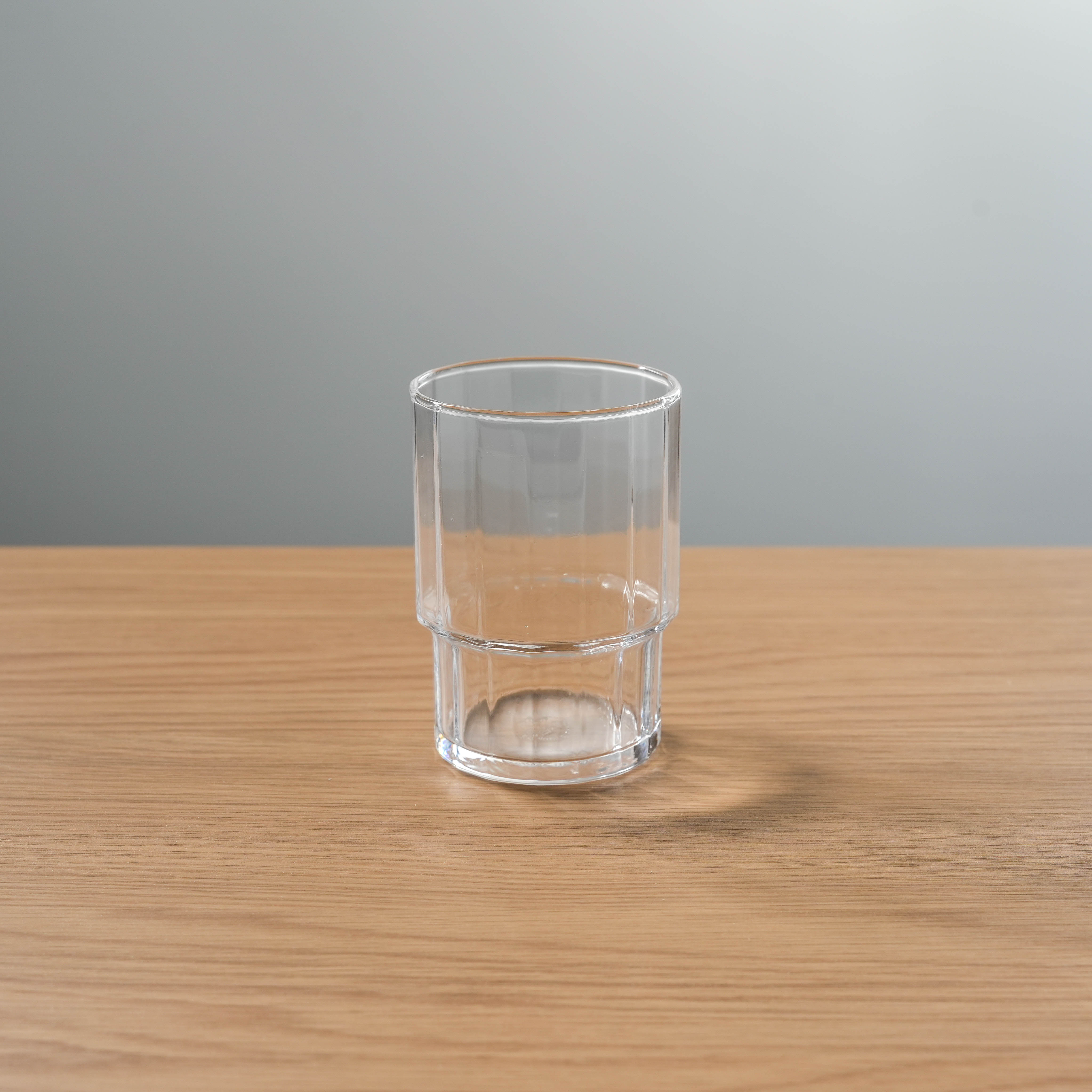 Toyo-Sasaki Tumbler Set - Japan Tumbler Polygon features a clear, stackable glass with a faceted base, ideal for modern drinkware collections.
