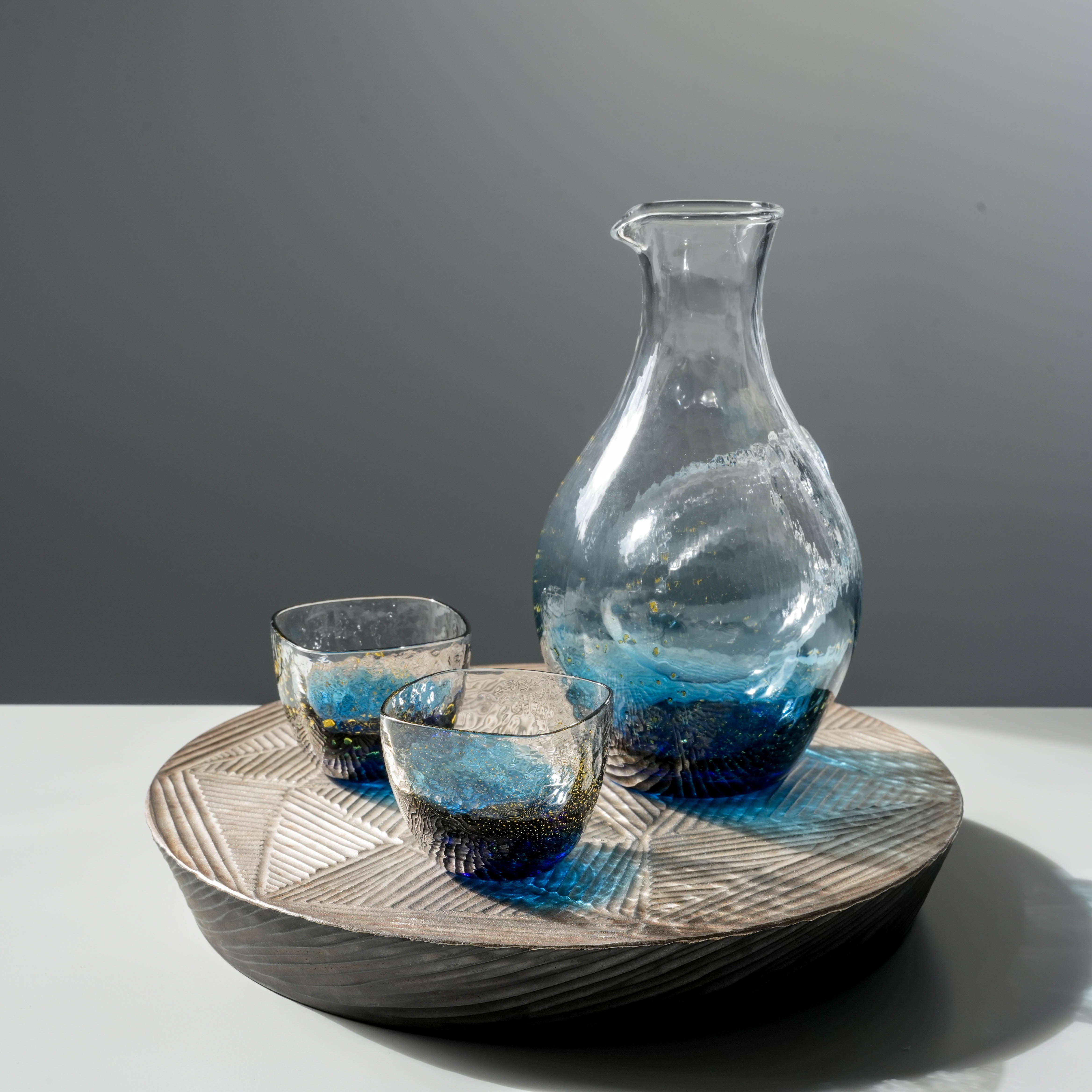Toyo-Sasaki Sake Set - Sapphire Blue Gift displayed on a decorative tray, combining traditional Japanese elegance with modern design.