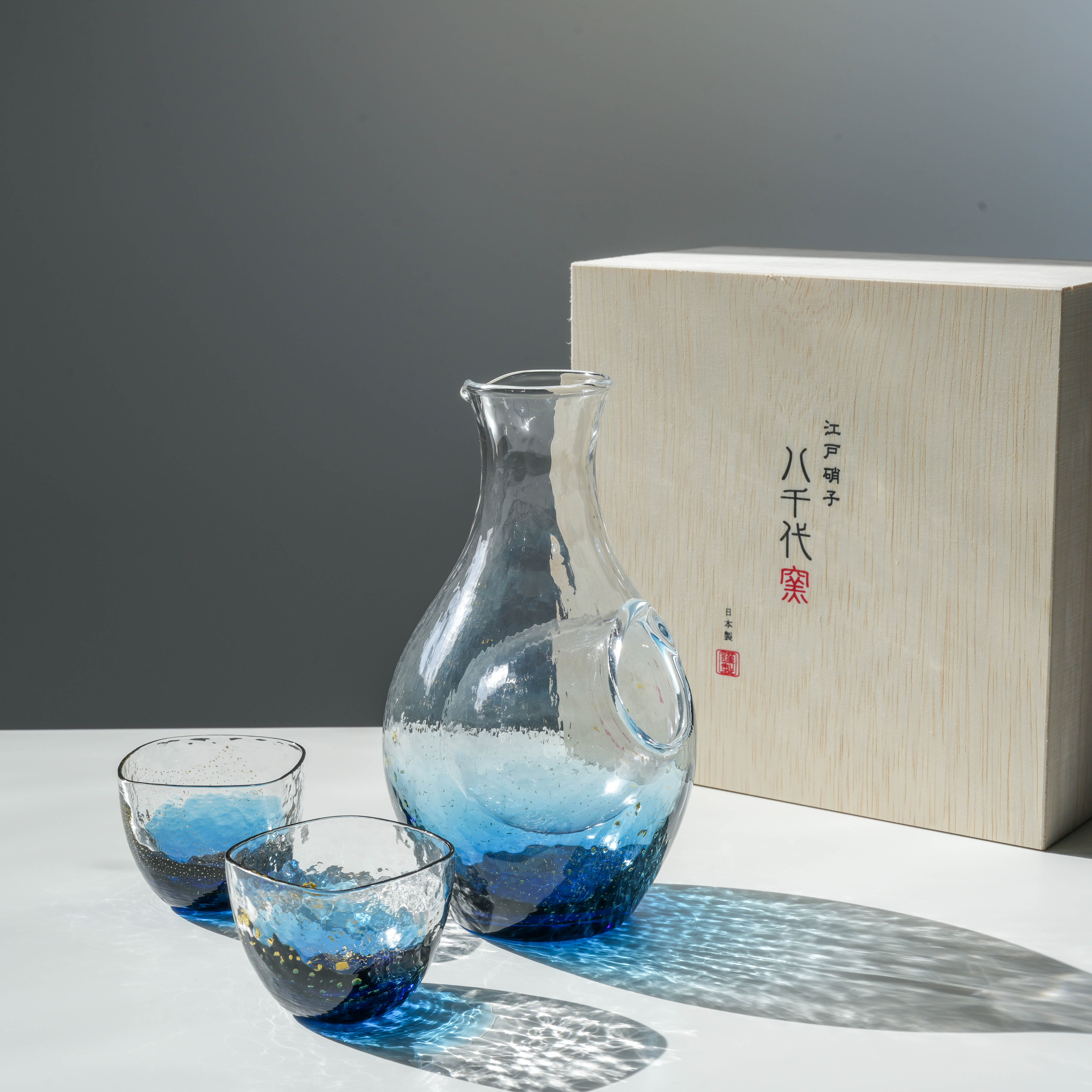 Toyo-Sasaki Sake Set - Sapphire Blue Gift includes a traditional Edo Glass carafe and cups, presented in a wooden gift box, perfect for gifting.