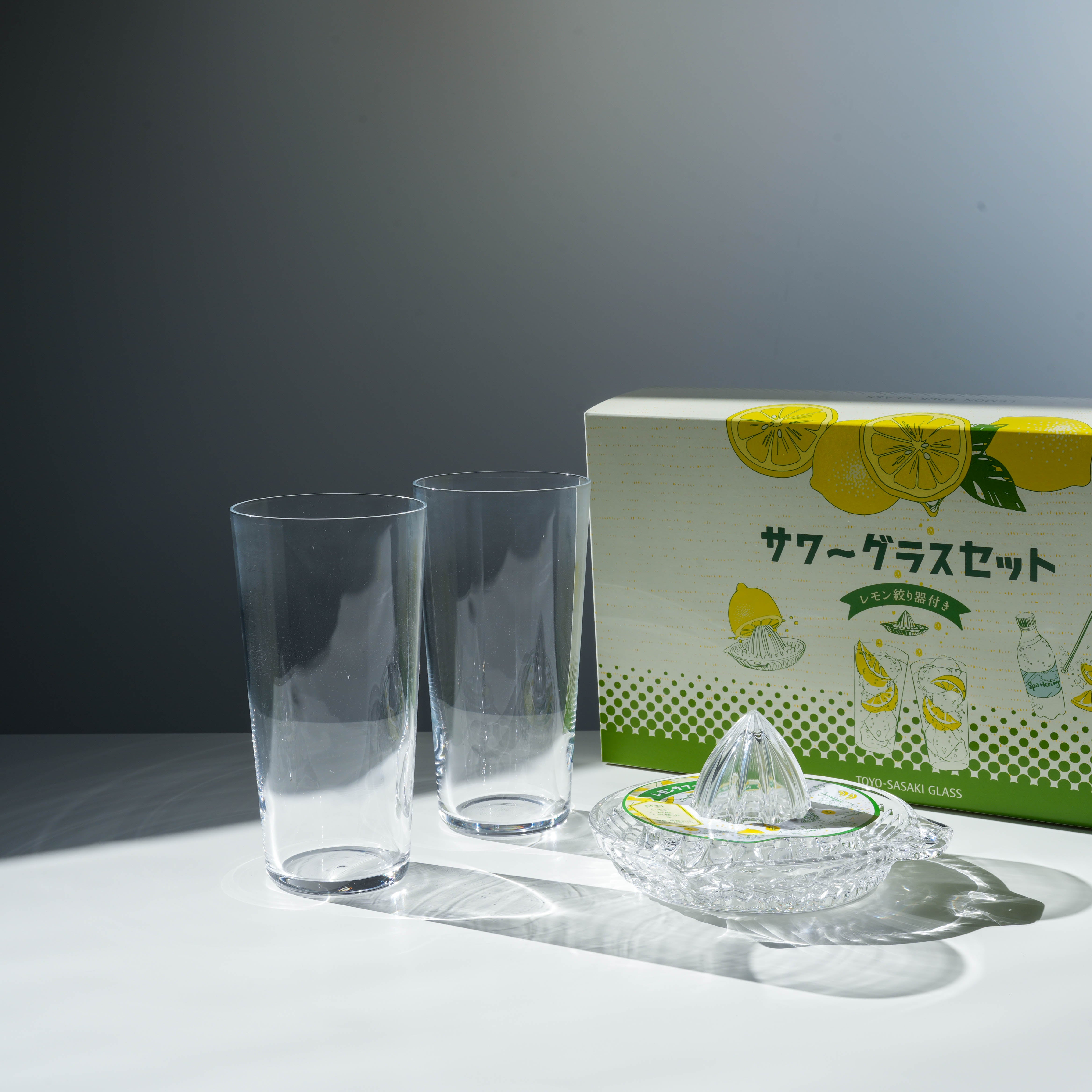 Toyo-Sasaki Glass Set - Lemonade Glass Set with two tall clear glasses and a crystal squeezer, made in Japan, ideal for cocktails or lemonade.