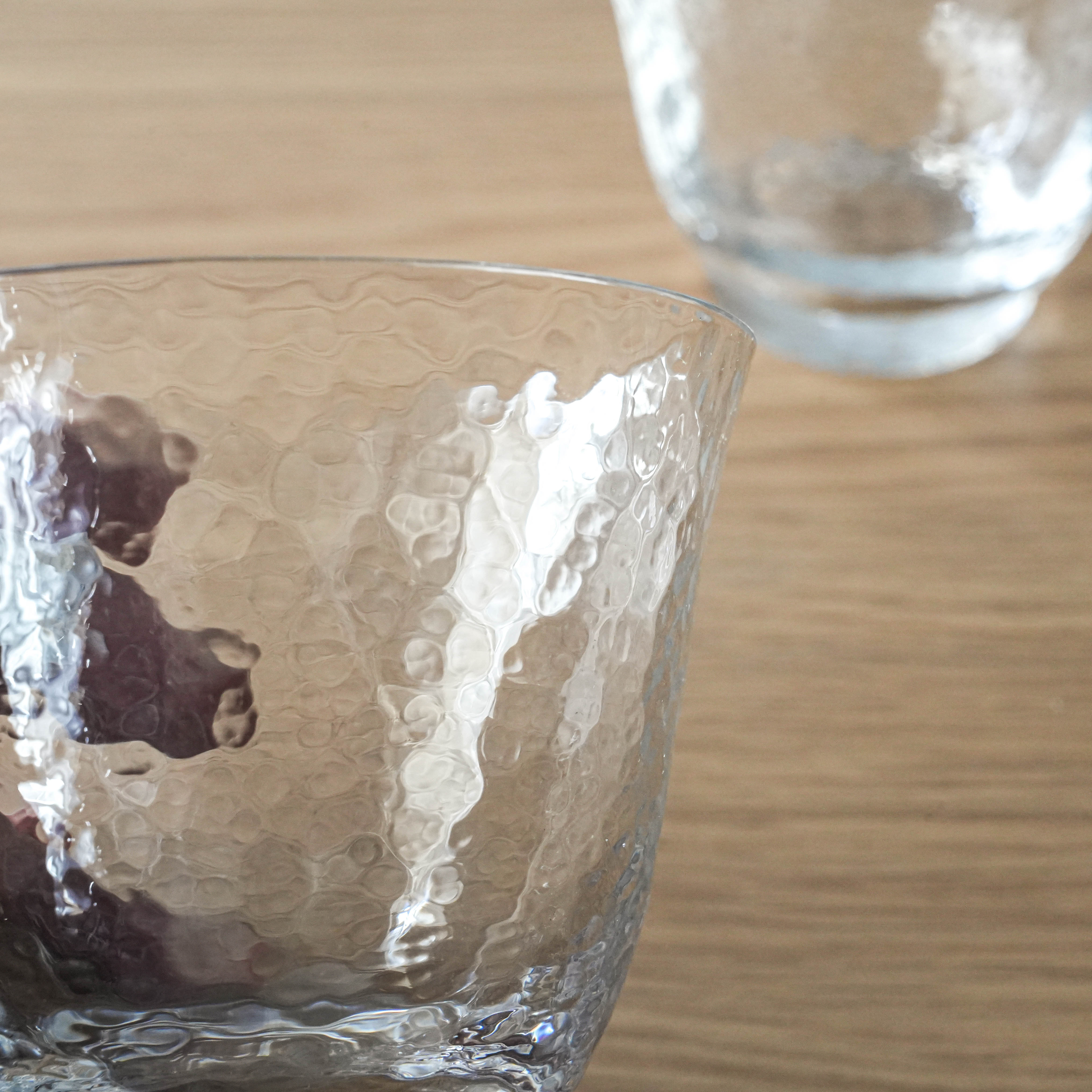 Close-up of Toyo-Sasaki Crystal Glass - Japanese Crystal cold tea glass highlighting the intricate hammered texture and clarity.
