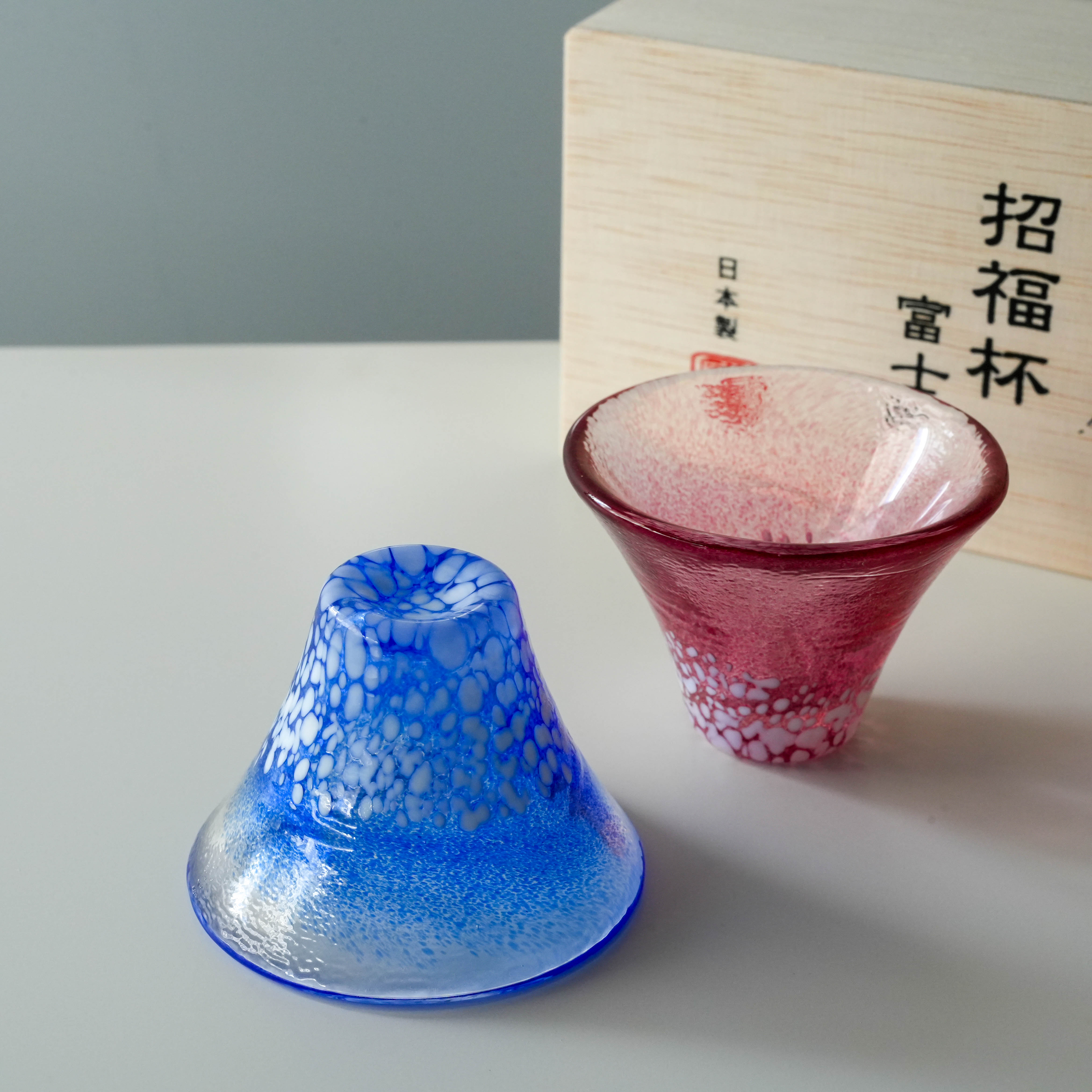Unique Mt. Fuji Design Fuji Sake Cup Set - Handmade Japan, featuring 35ml red and blue glass cups with wooden box, ideal for cold sake.