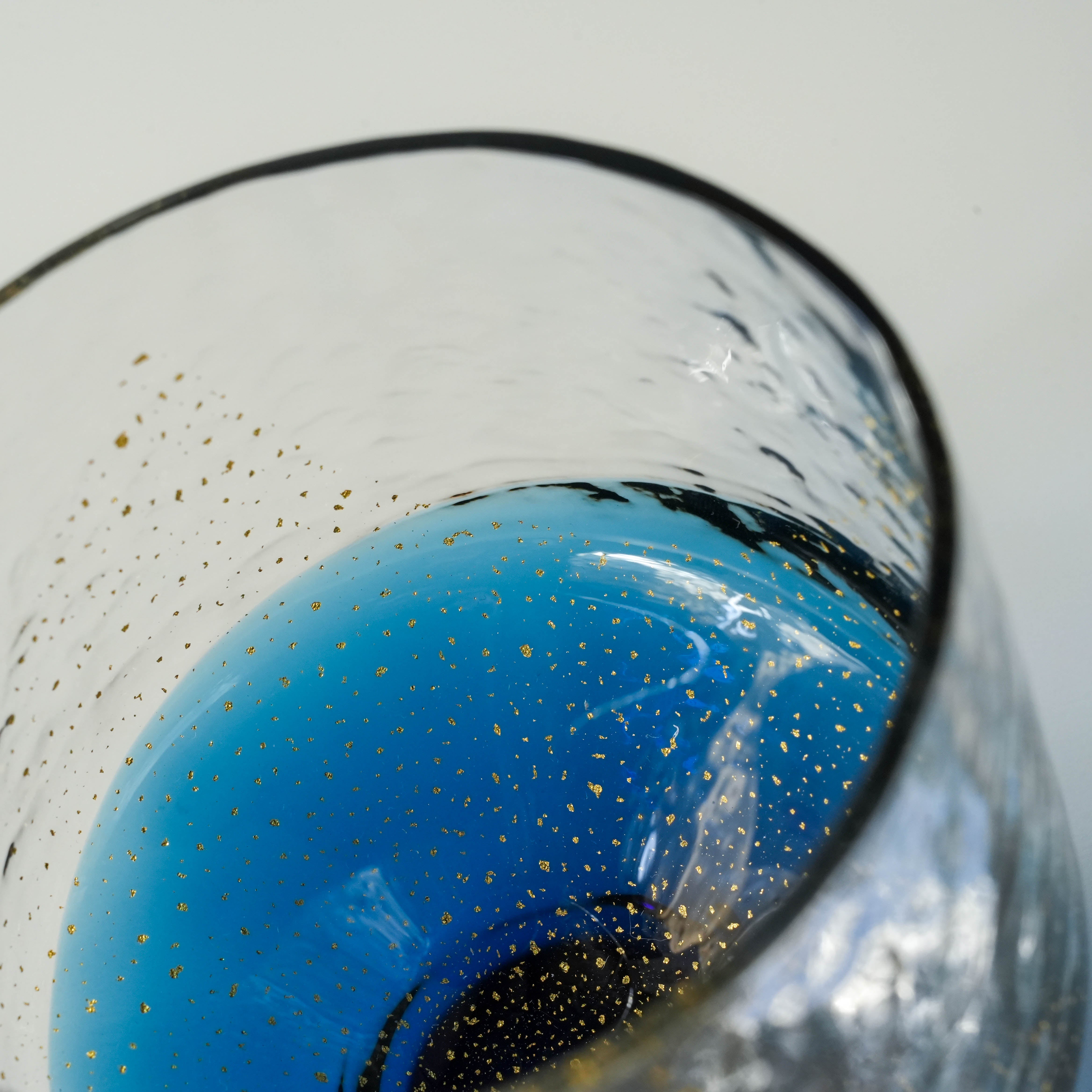 Interior view of Toyo-Sasaki Sapphire Tumbler showing vivid blue base and intricate golden sparkles, handcrafted in Japan.