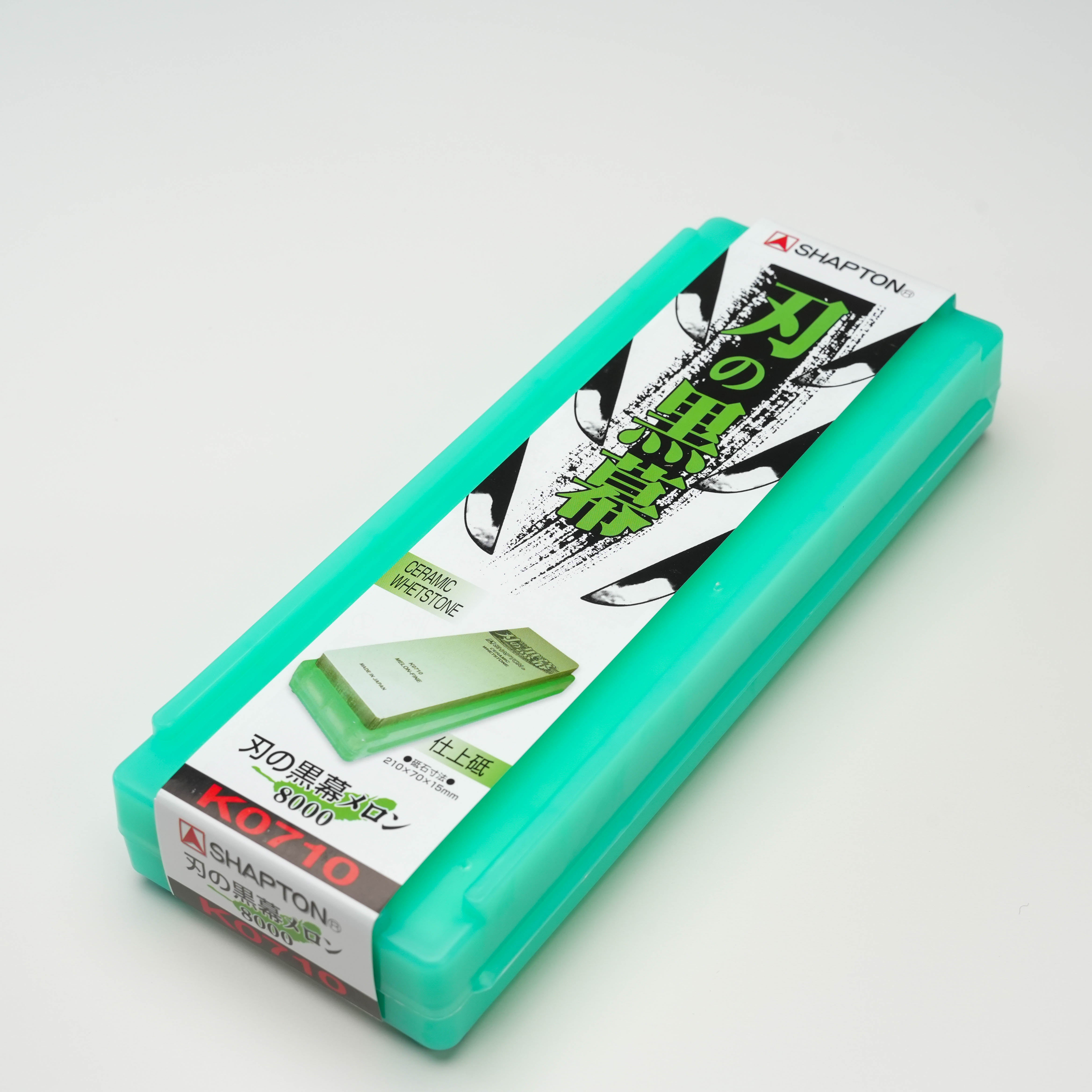 Shapton KUROMAKU 8000 Grit Stone in green case, ideal for mirror finish sharpening with no soaking required. Compact and doubles as a stand.