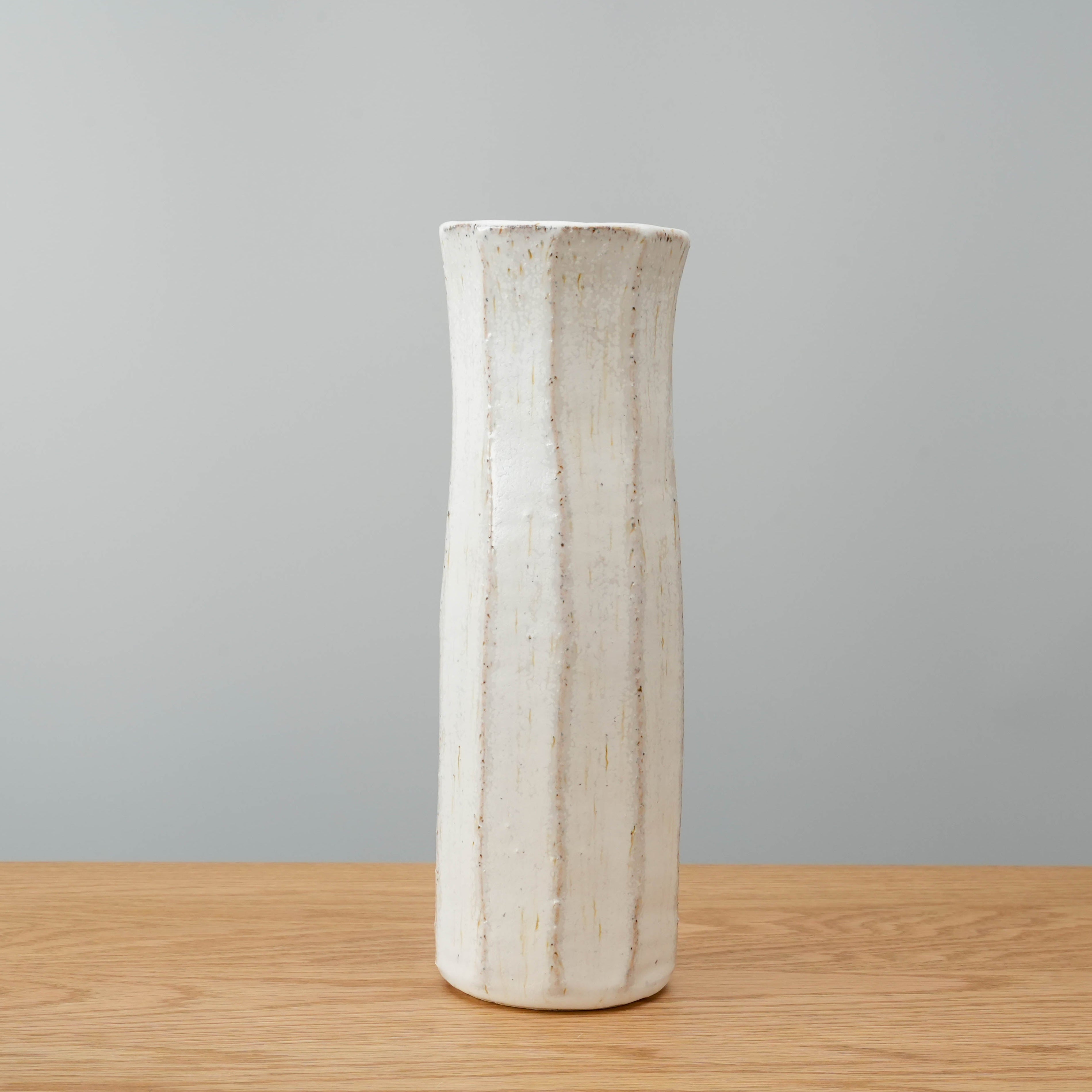 Shigaraki Flower Vase in white ash glaze from Shisui Kiln, showcasing earthy texture and vertical grooves ideal for minimalist decor.