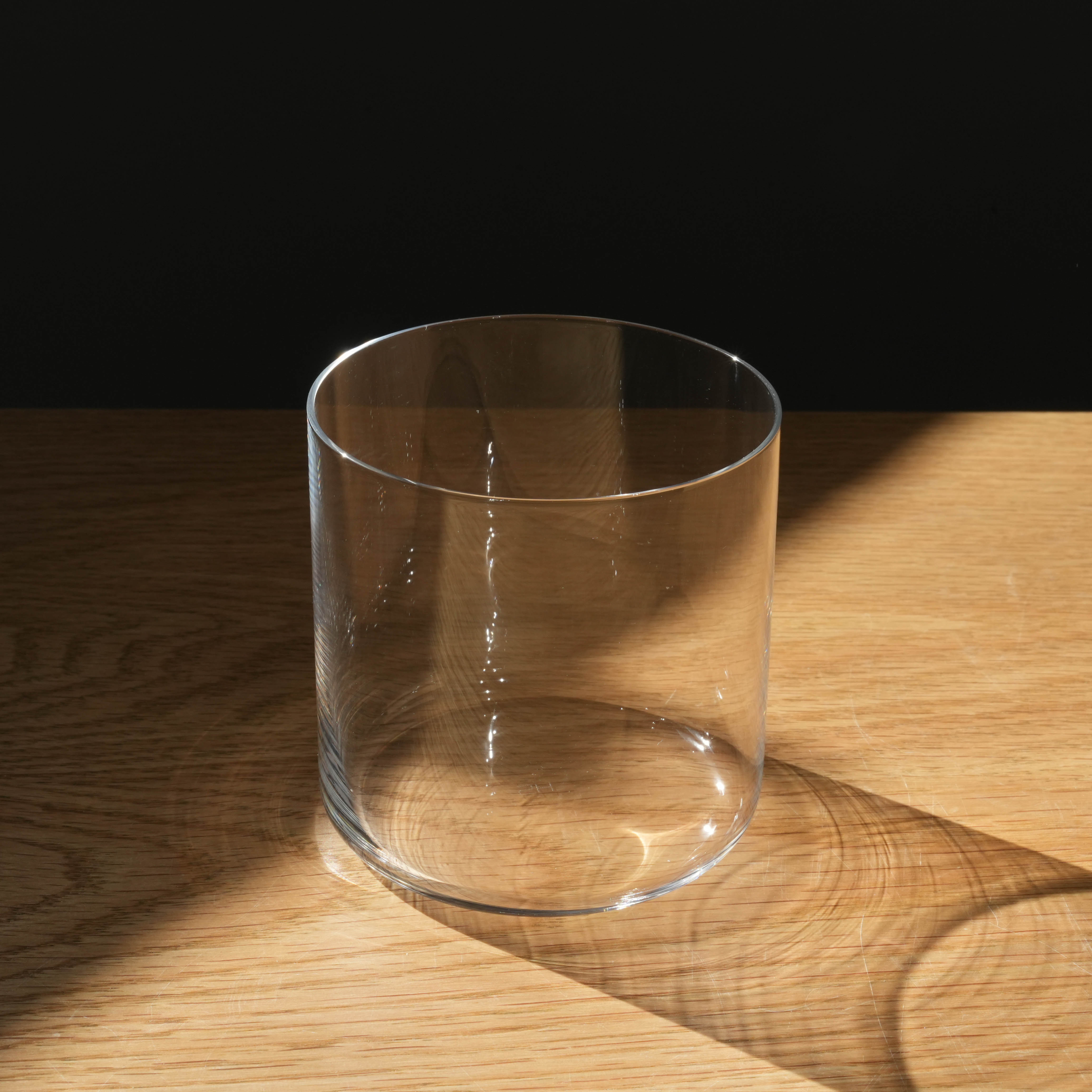 Close-up of Toyo-Sasaki HS Usurai Tumbler on wood table, showcasing its ultra-thin, scratch-resistant glass perfect for elegant drinkware collections.