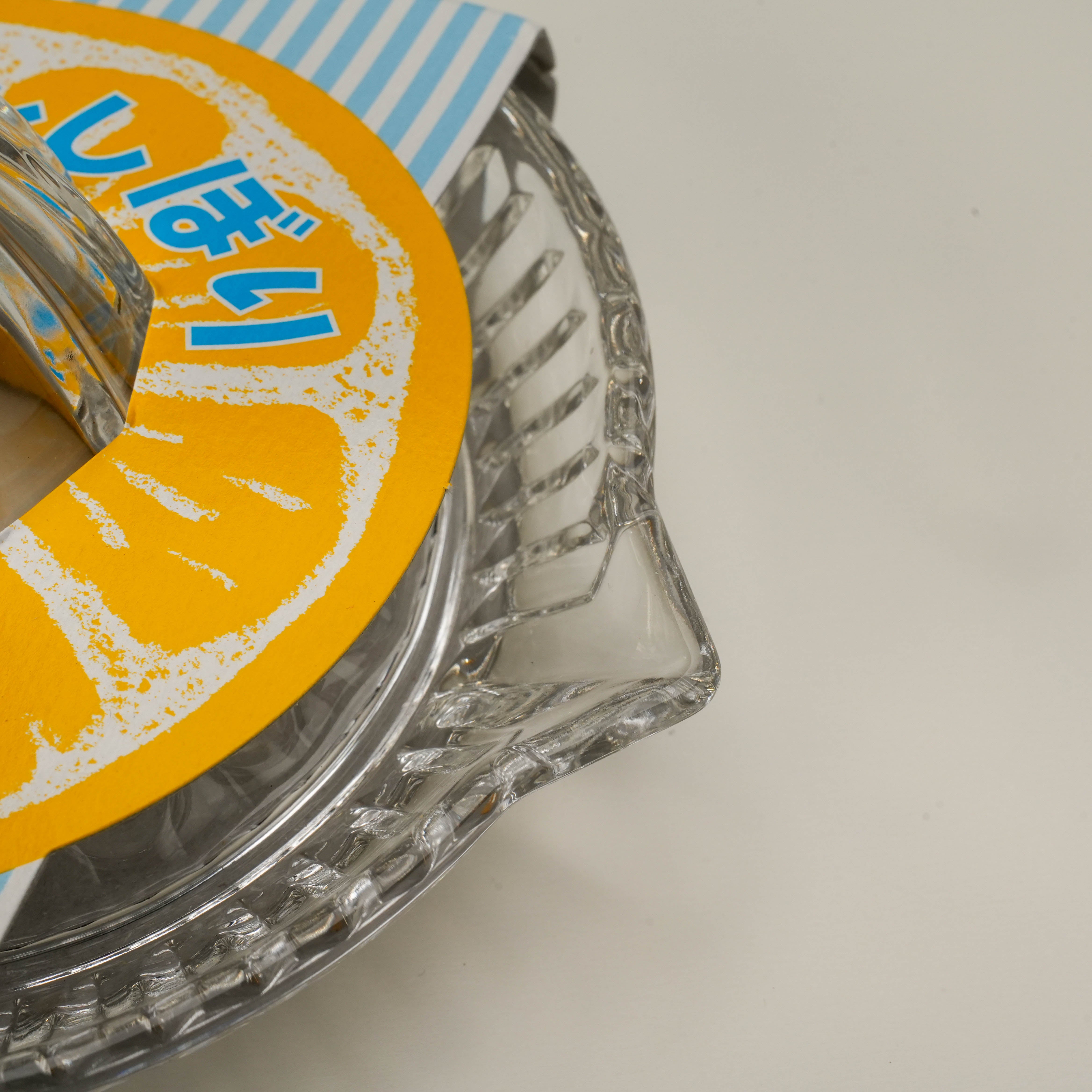 Close-up of Toyo-Sasaki Lemon Squeezer showing durable glass spout and textured bowl, perfect for efficient juice extraction.