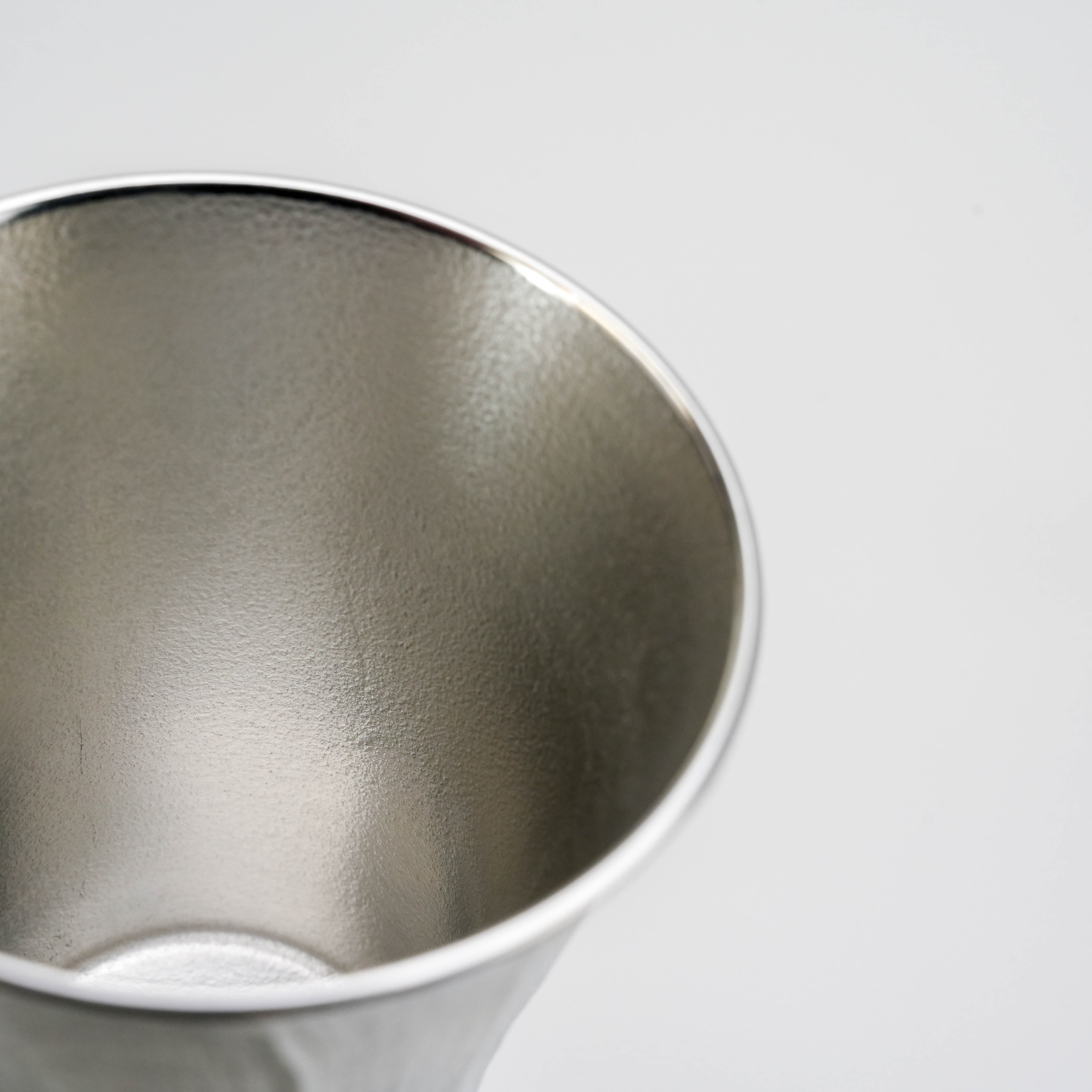 Interior view of Osaka Suzuki Tumbler - Tin Tumbler | Japanese Craft, 200ml highlighting its smooth, polished tin surface.
