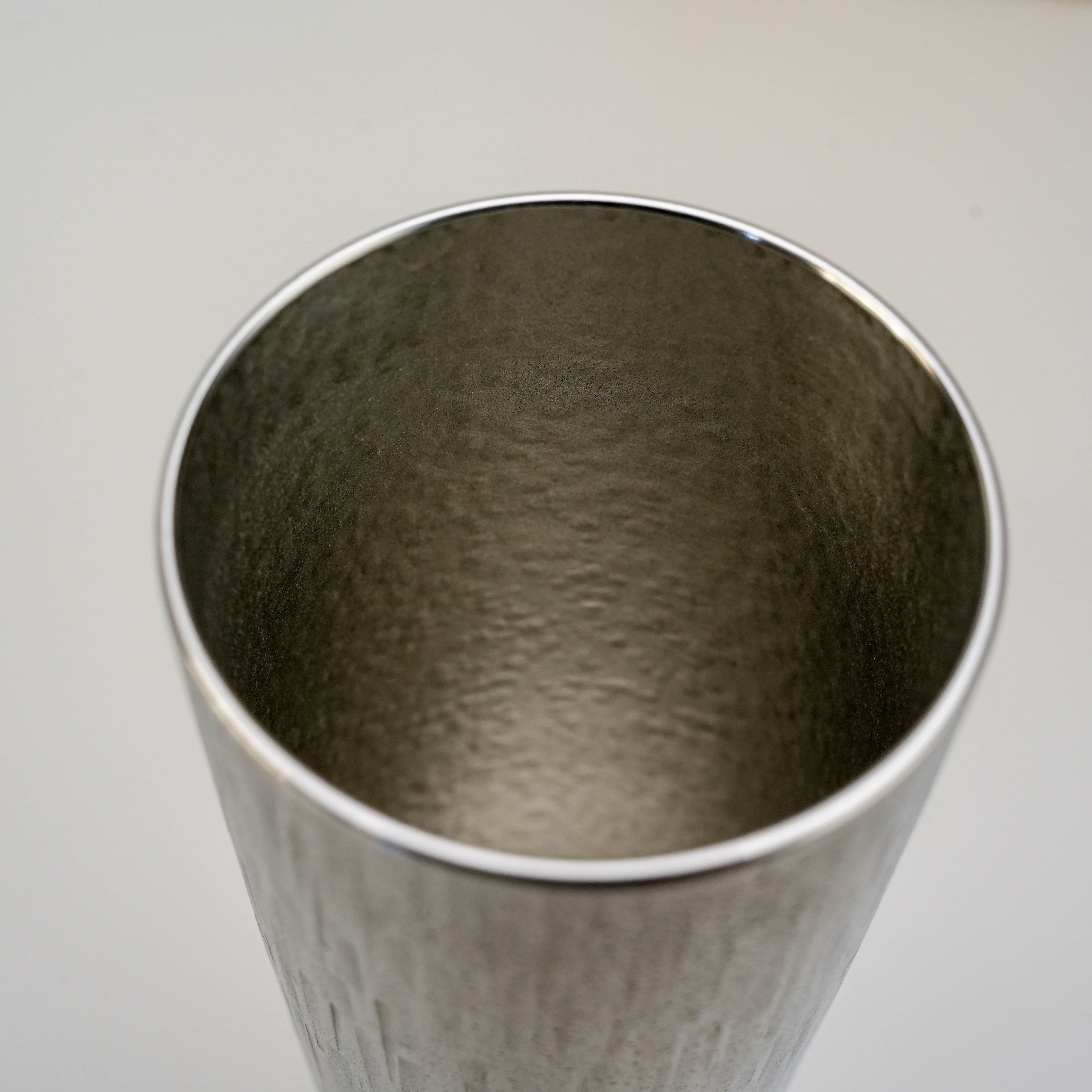 Interior view of the Osaka Suzuki Tinware Tumbler, revealing its smooth, hammered tin texture for a refined drinking experience.