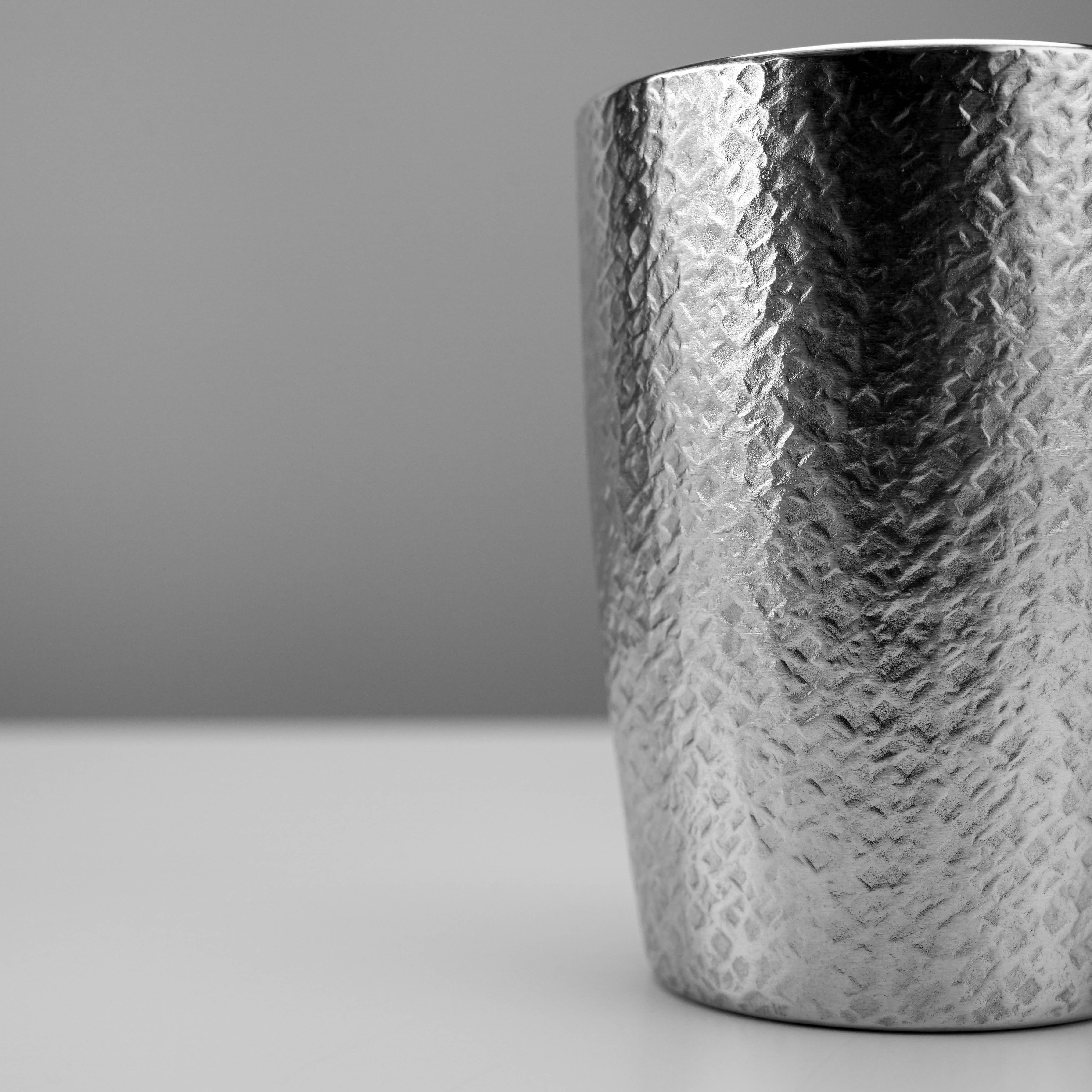Osaka Tinware Tumbler Set - Tin Tumbler | Pure Tin, 2pc highlights the intricate hammered design and polished finish of a single pure tin tumbler.