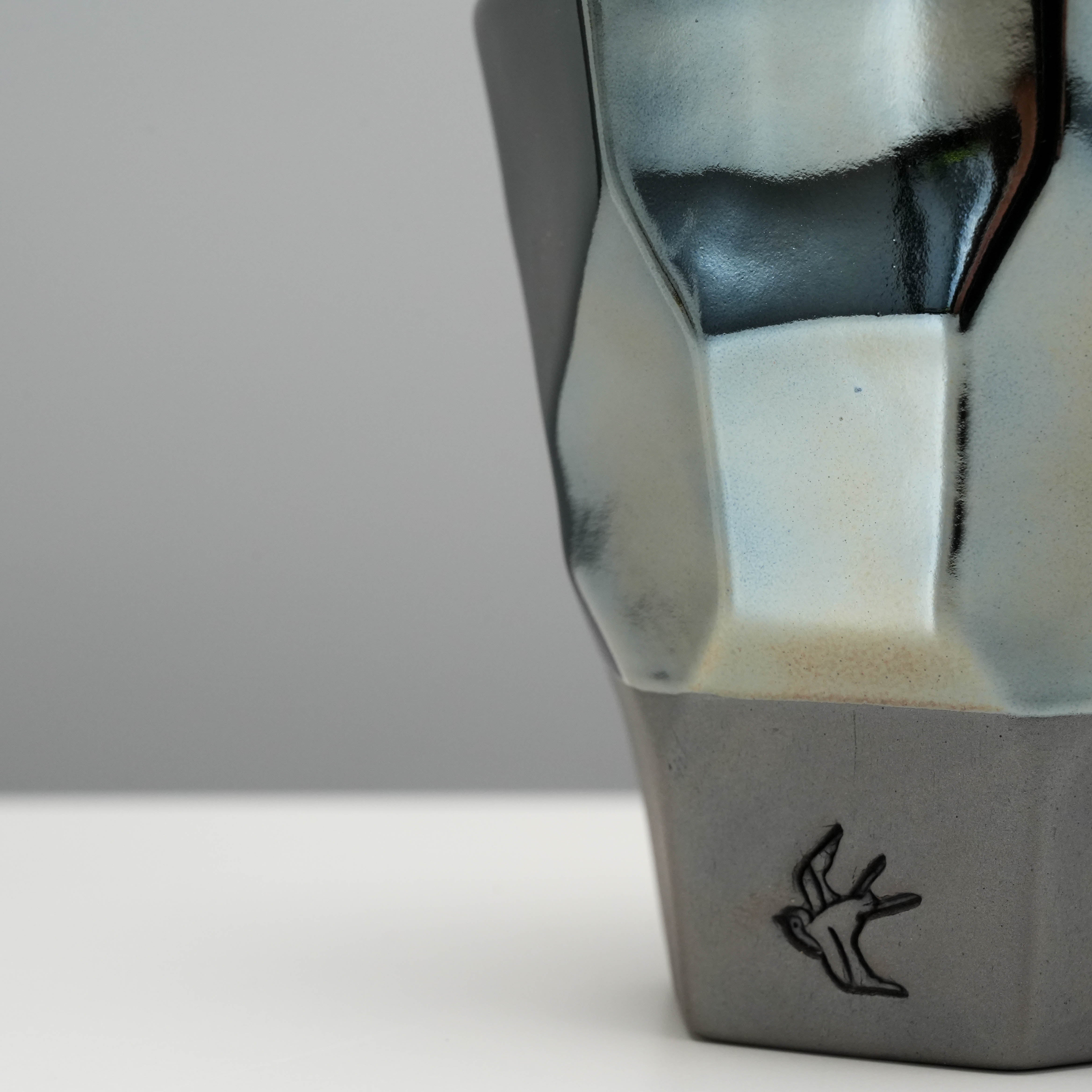 Close-up of Tsubame Kobo Free Cup - Tumbler highlighting textured black clay base and platinum blue glaze finish.