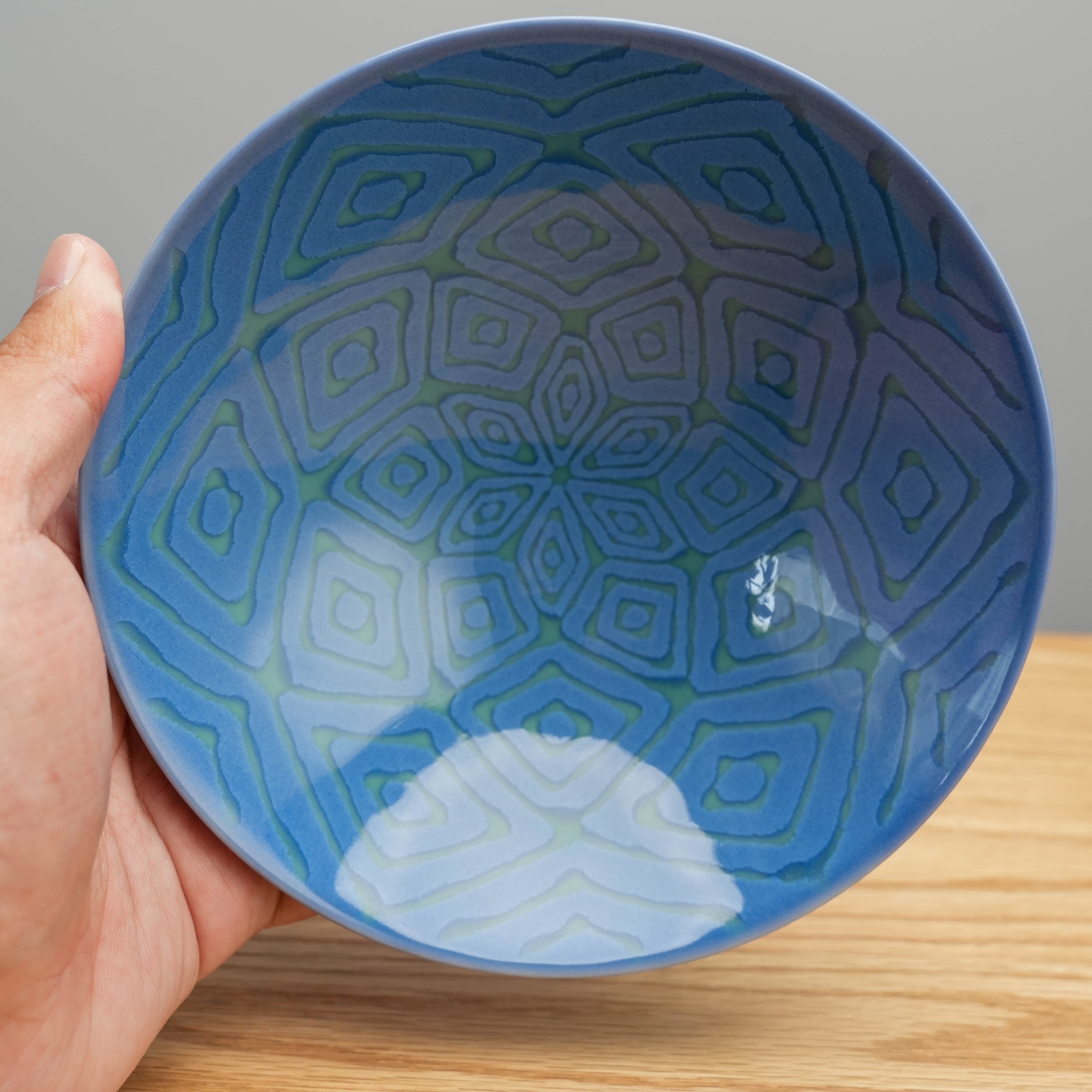 Top view of Hasami Ware Hakusan Blue Rice Bowl highlighting symmetrical diamond pattern, perfect for elegant food storage or serving small dishes.