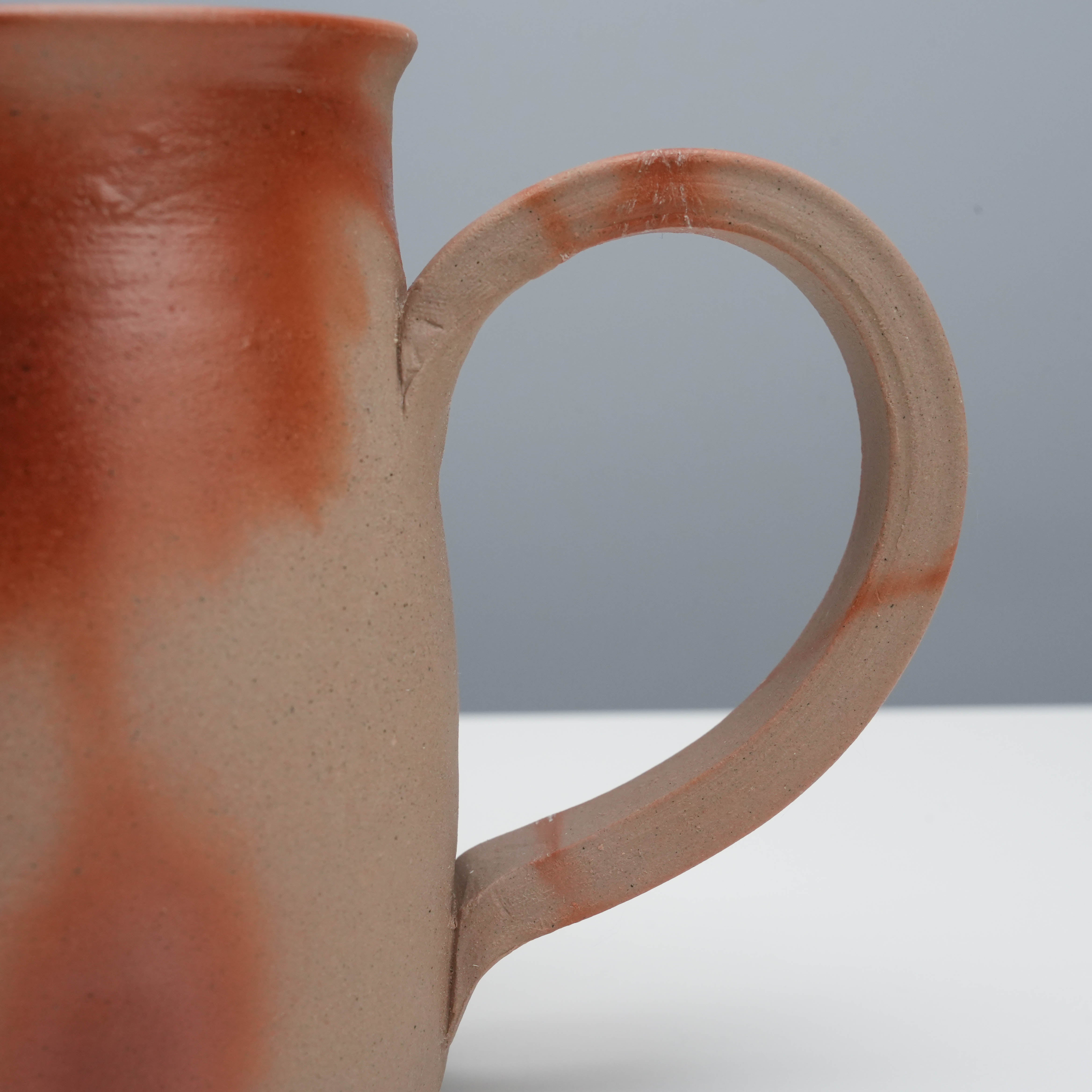 Close-up of Bizen Ware Kiln Beer Mug handle, highlighting handmade texture and natural clay finish for a unique and sturdy grip.