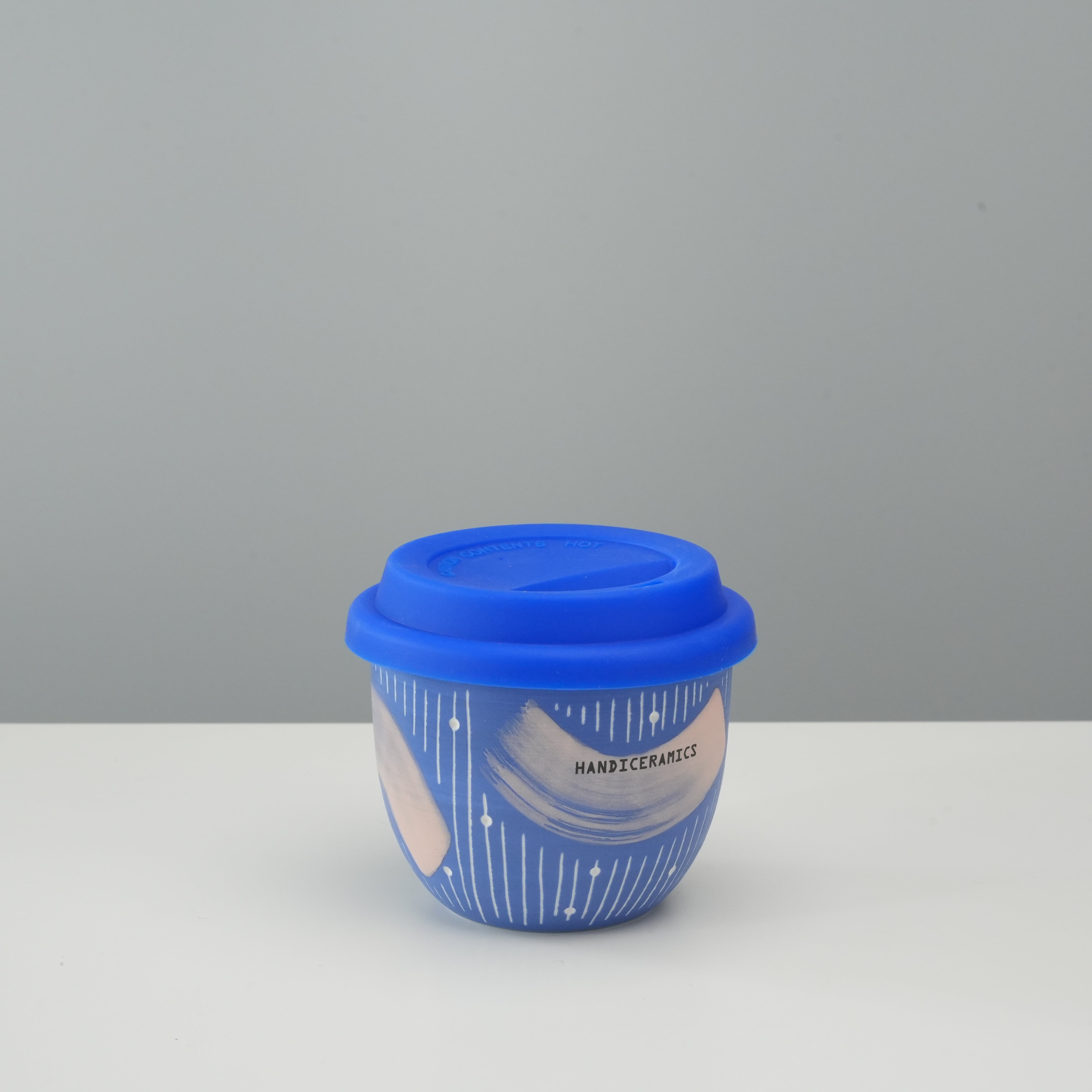Handiceramics Travel Cup - Ceramic Coffee Cup with Lid in Blueberry color, featuring a handmade design and silicone lid for on-the-go use.