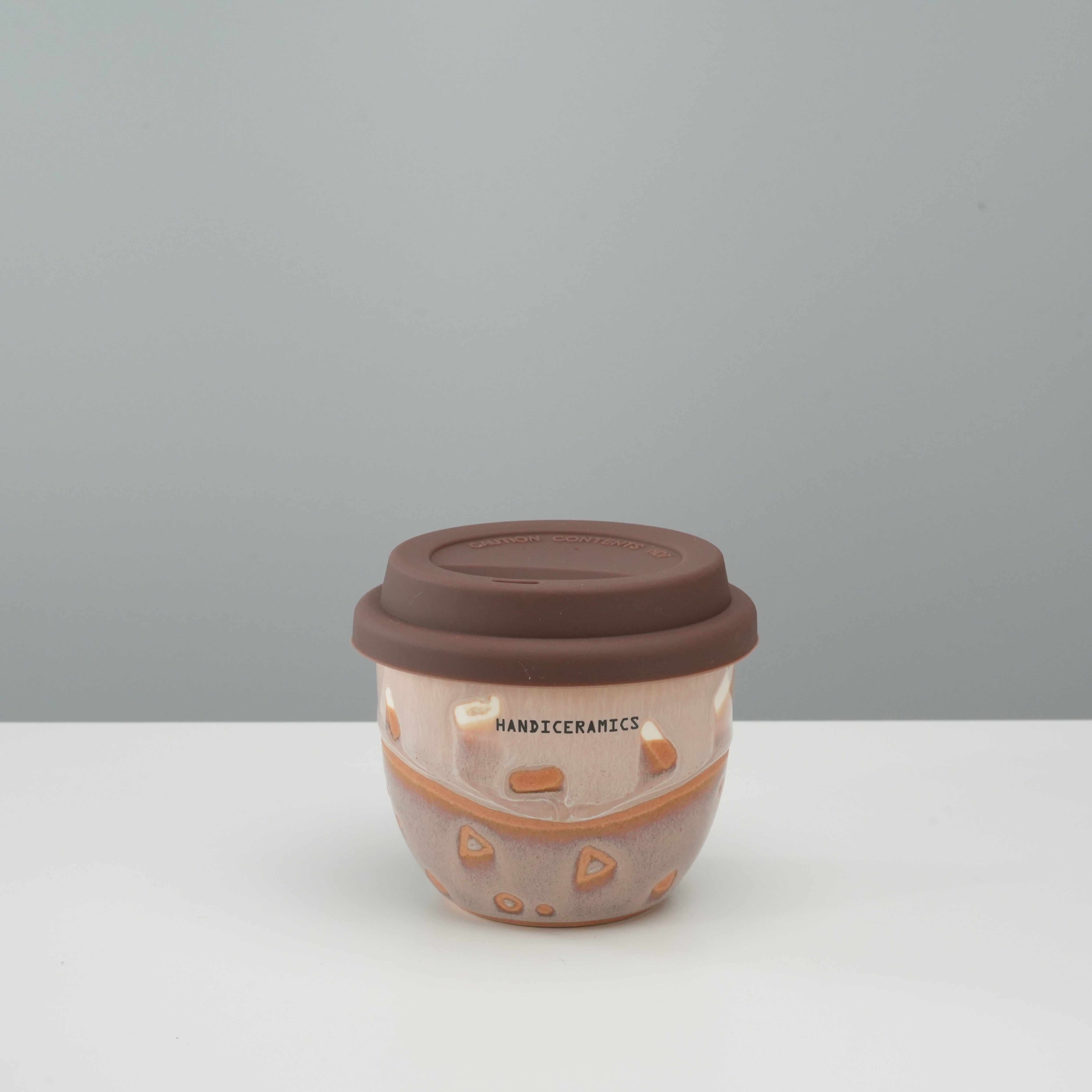 Handiceramics Travel Cup - Ceramic Coffee Cup with Lid in Taro color, featuring a compact design and silicone lid for spill-free sipping.