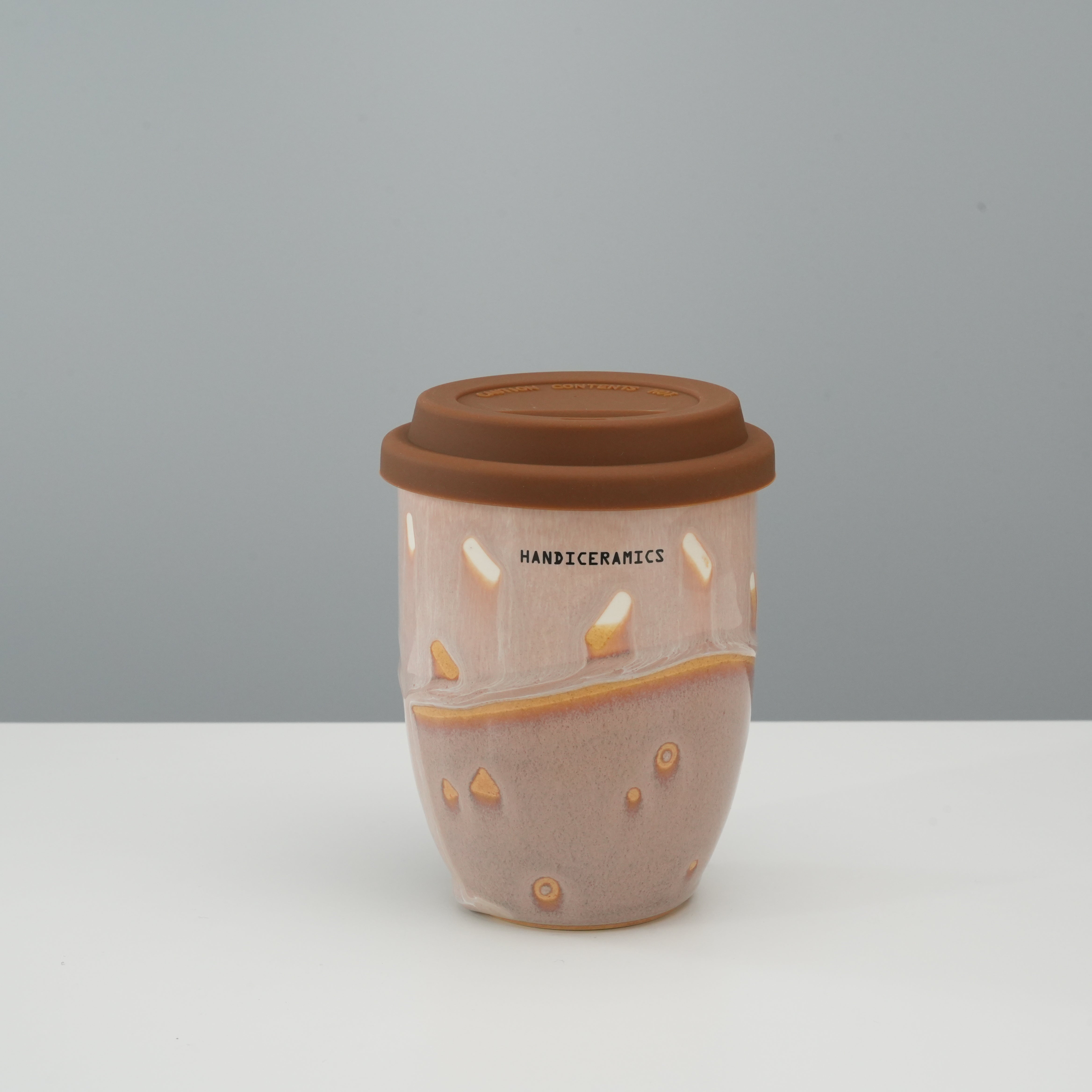 Tall version of the Handiceramics Ceramic Coffee Cup with Lid in Taro, perfect for daily commutes and eco-friendly beverage use.