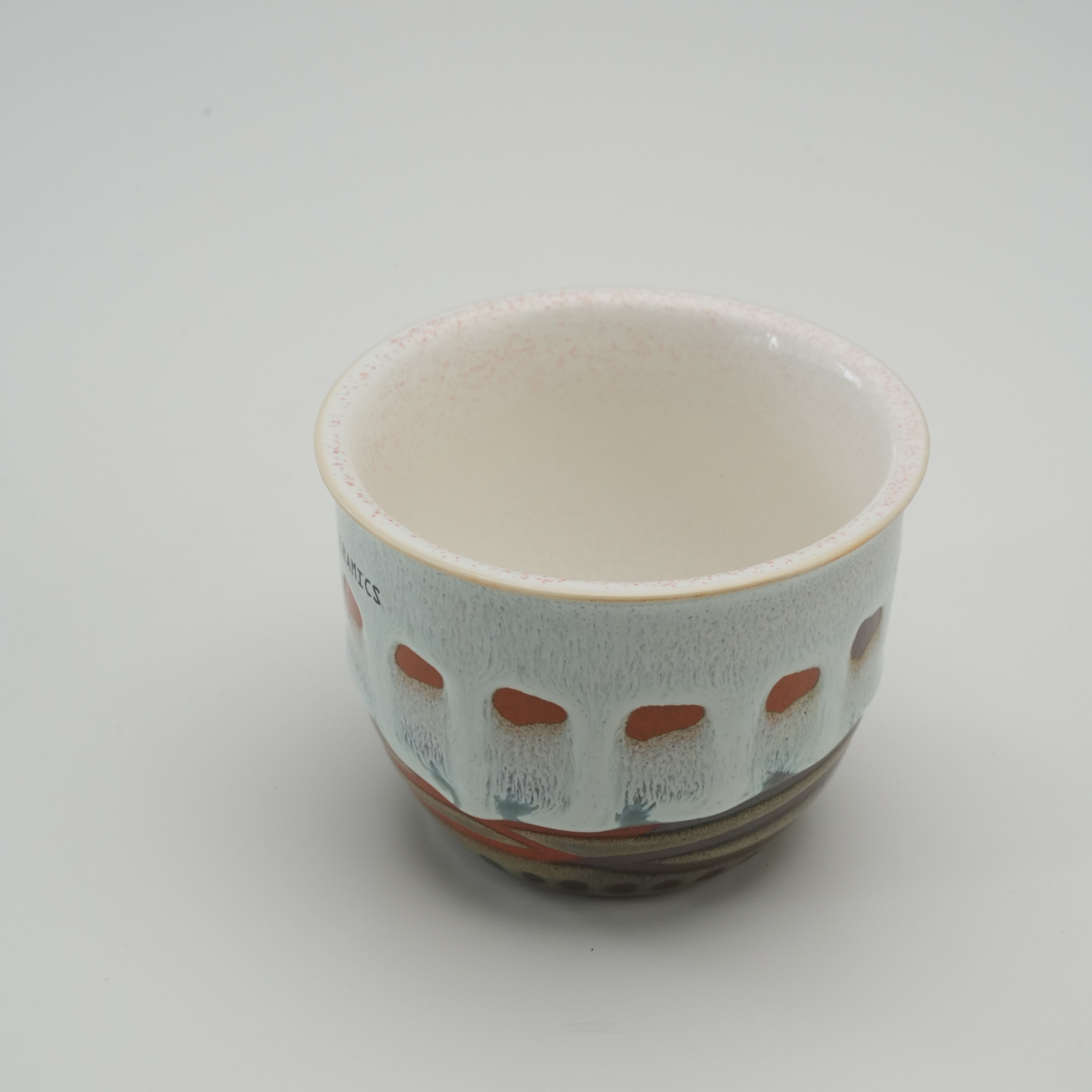 Interior view of Handiceramics Travel Cup - Ceramic Coffee Cup with Lid, highlighting smooth glazed finish and artisanal craftsmanship.