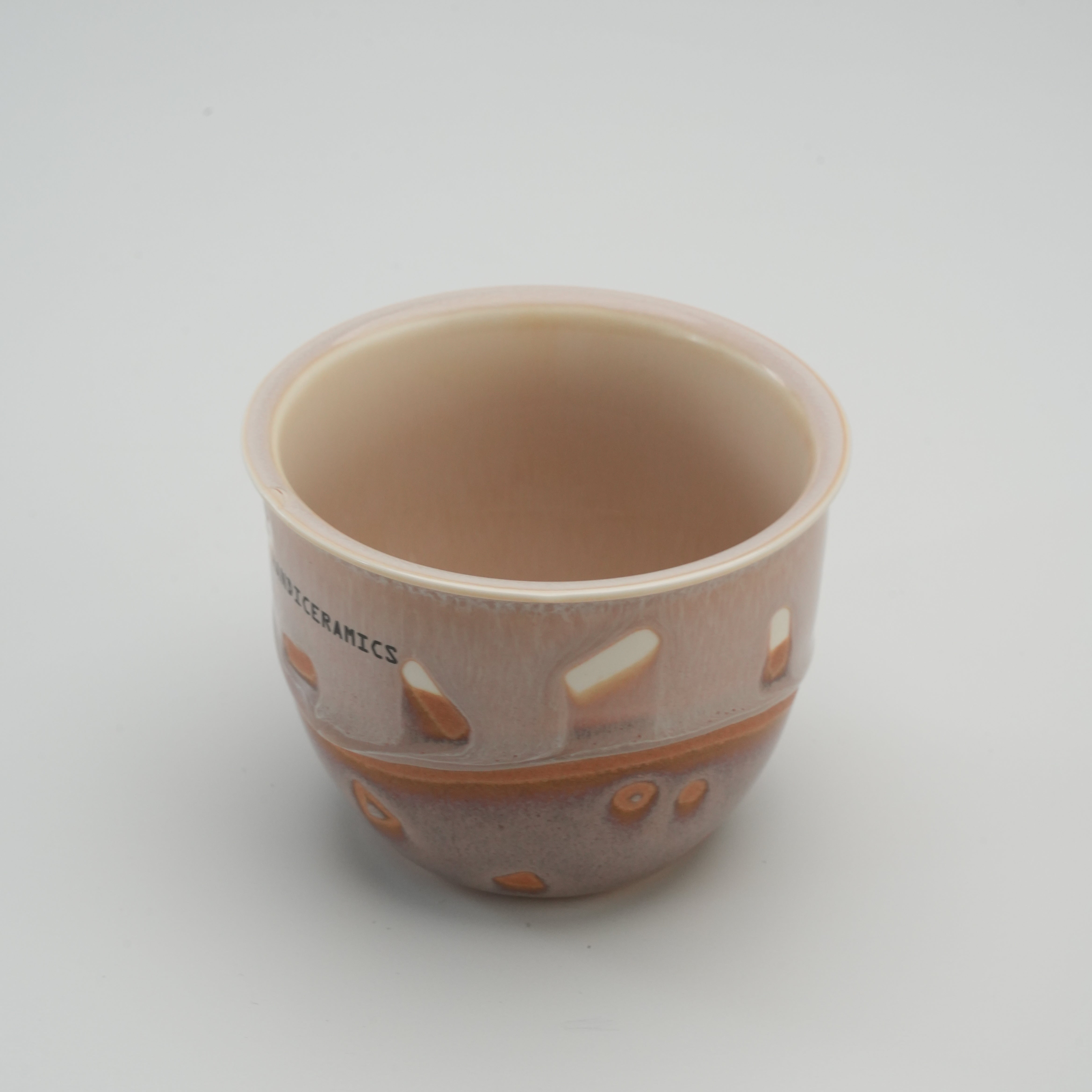 Open view of the Handiceramics Travel Cup in Taro, showcasing the smooth ceramic interior and artisan glaze finish.