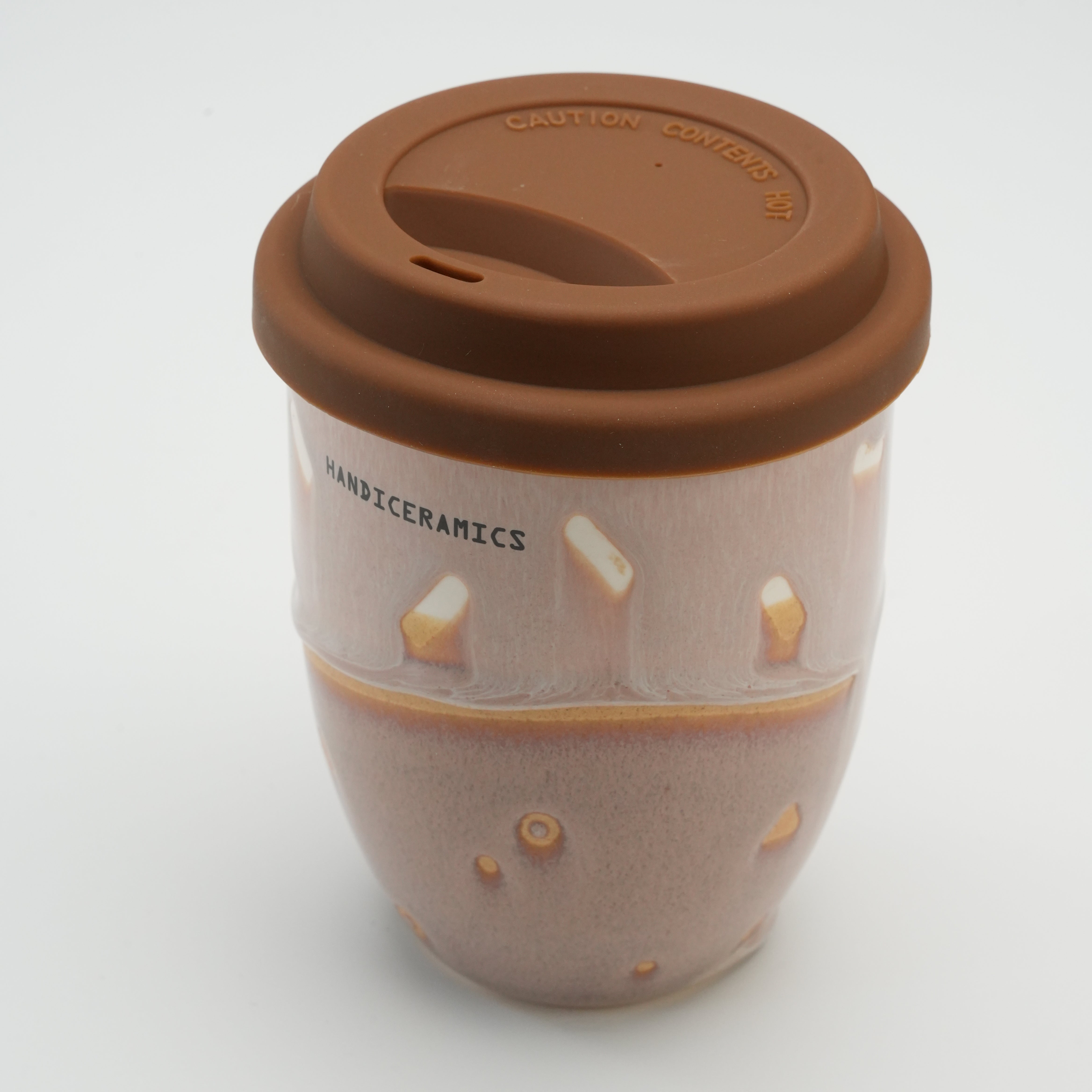 Angled top view of the Handiceramics Boba Travel Cup in Taro with a secure silicone lid, designed for stylish and sustainable drinkware.