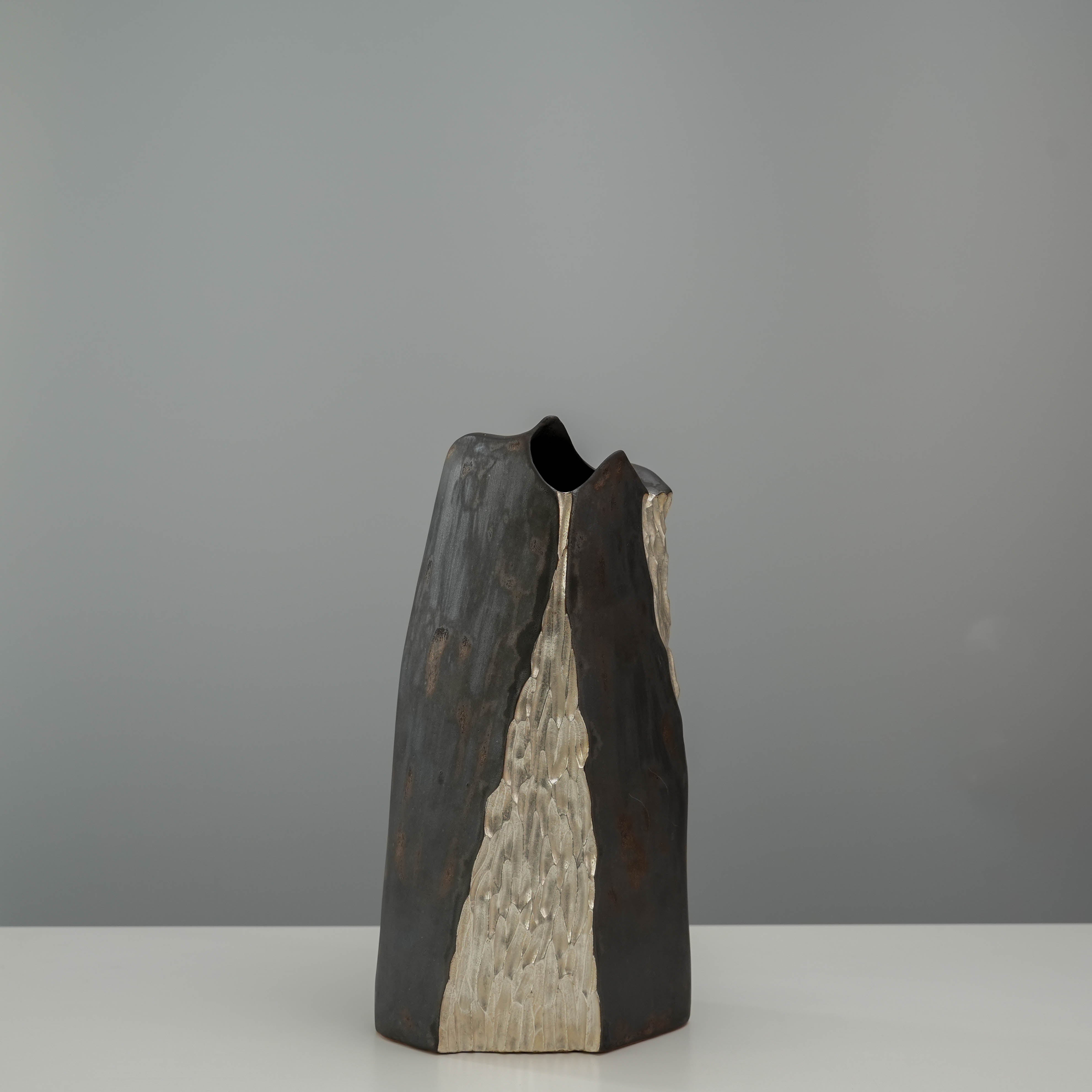 Lonesome Studio Vase - Mountain Form in silver and black-gold finish, featuring a sculpted peak-like design for modern home decor.