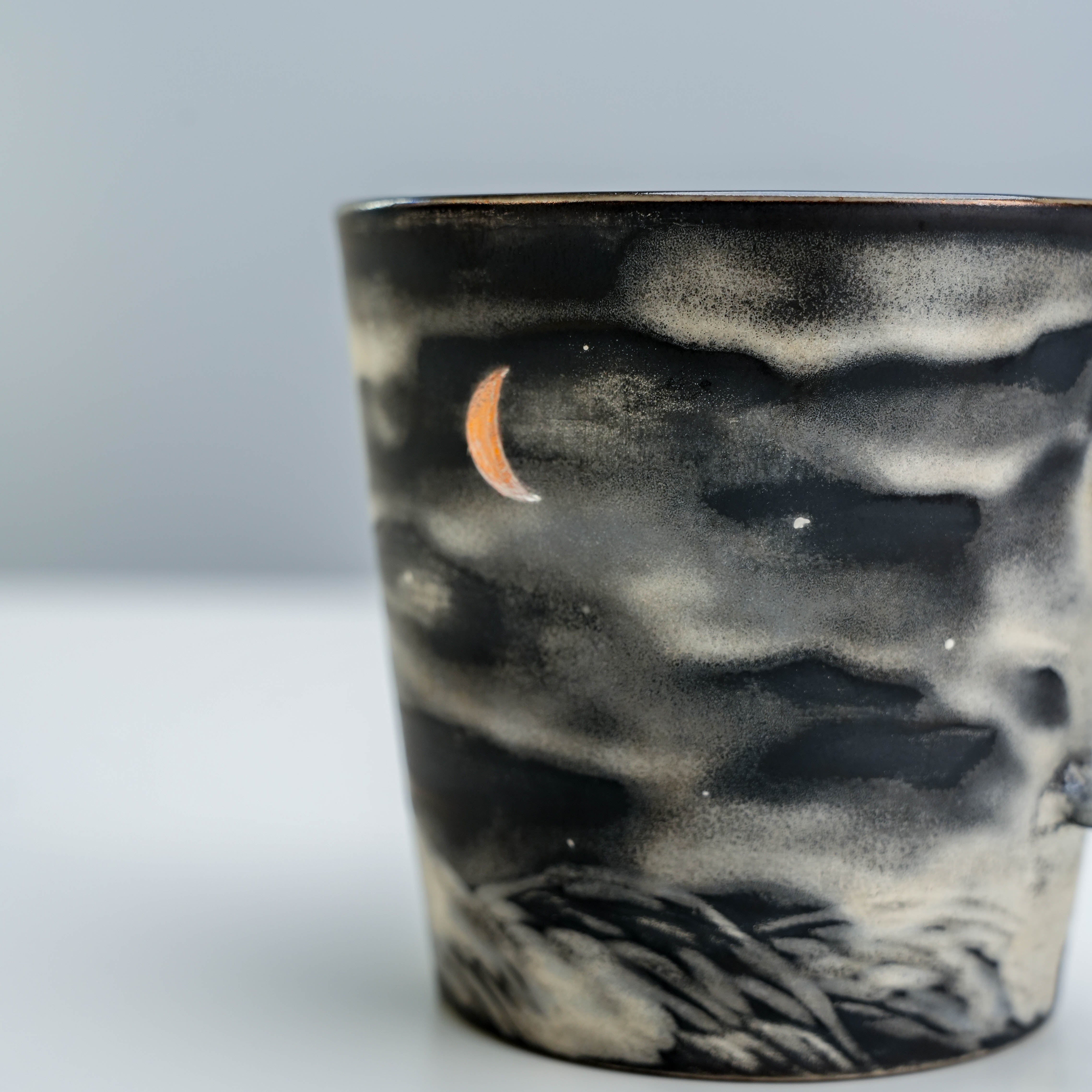 Detailed view of crescent moon and silver glaze on Lonesome Studio coffee mug, emphasizing artistic craftsmanship.