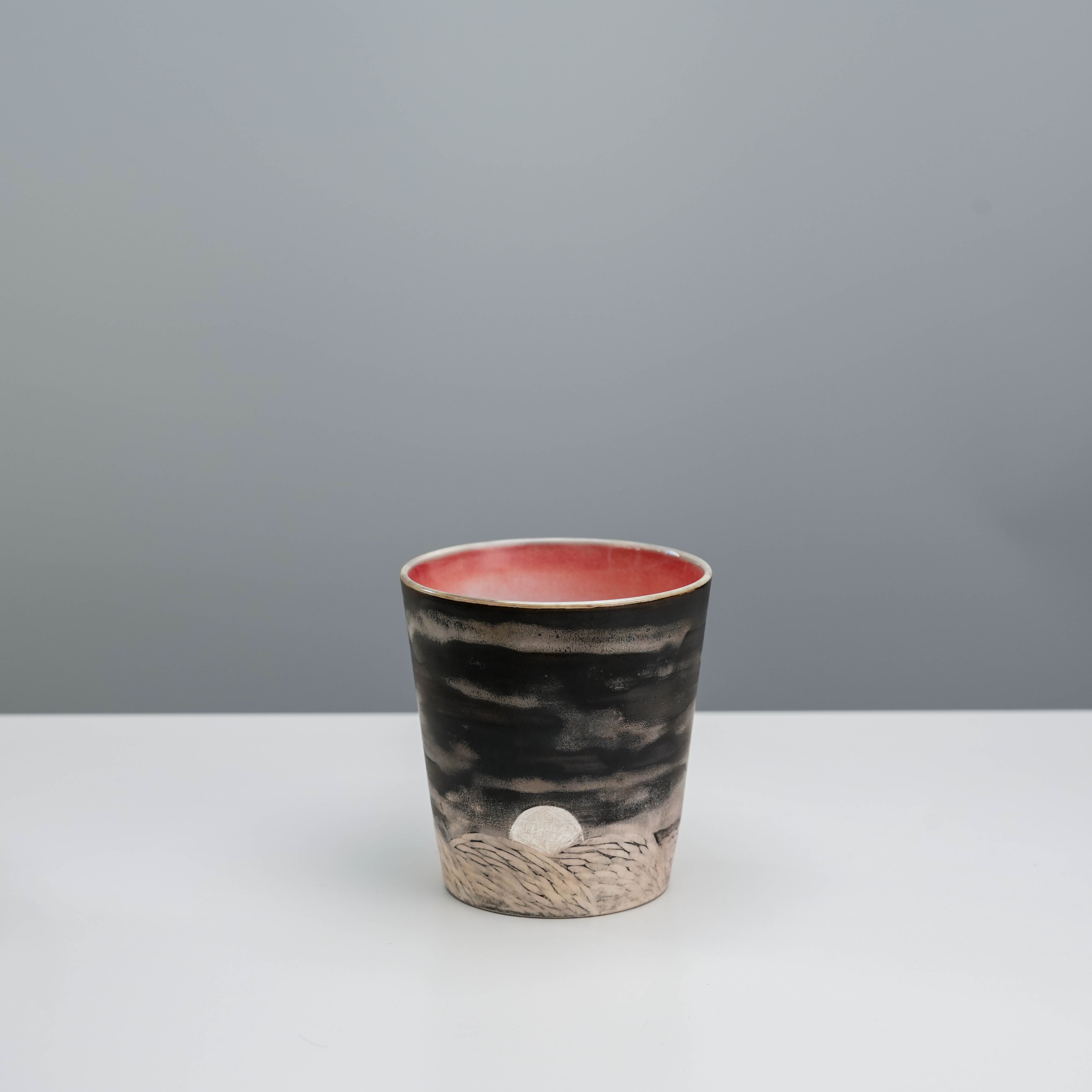 Handcrafted Evening Moon coffee tumbler with silver-glazed rising moon and carved hills, 300ml ceramic mug from Lonesome Studio.