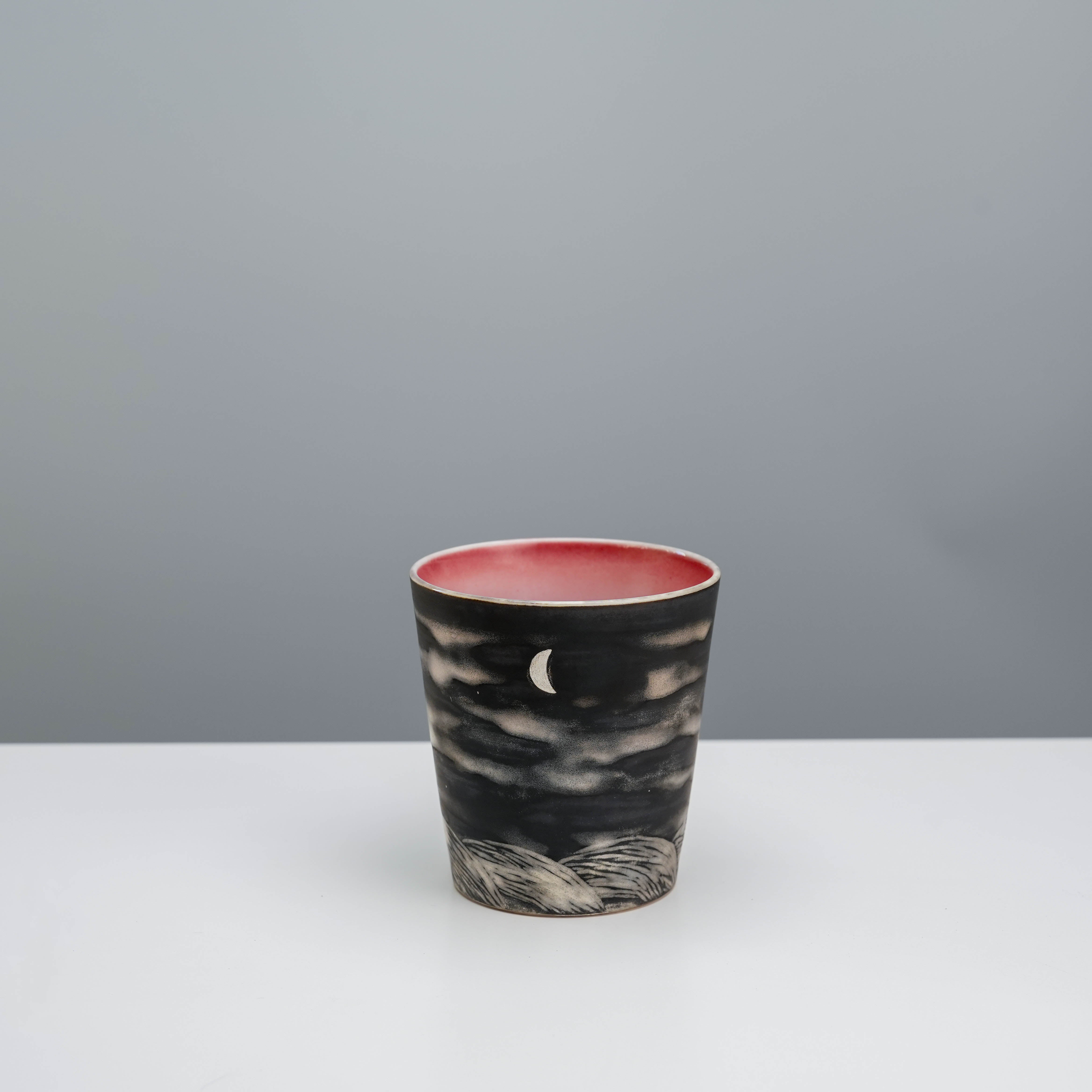 Lonesome Studio Moon Tumbler with crescent moon and cloud design, 300ml ceramic coffee tumbler in black and red by Silver Craft.