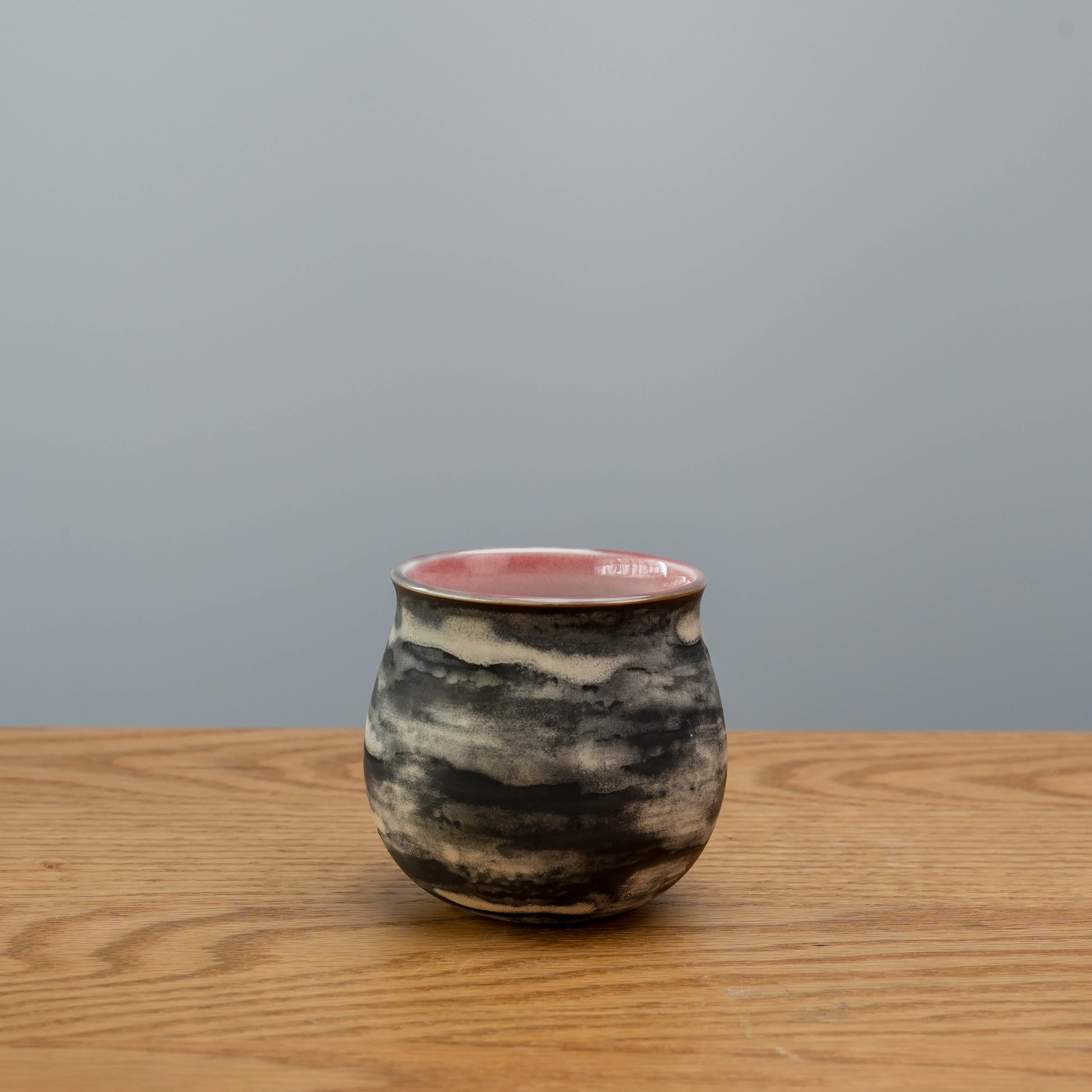 Cloudy Evening Cup by Lonesome Studio with 200ml capacity, featuring a smoky black glaze and pink interior for enhancing coffee aroma.