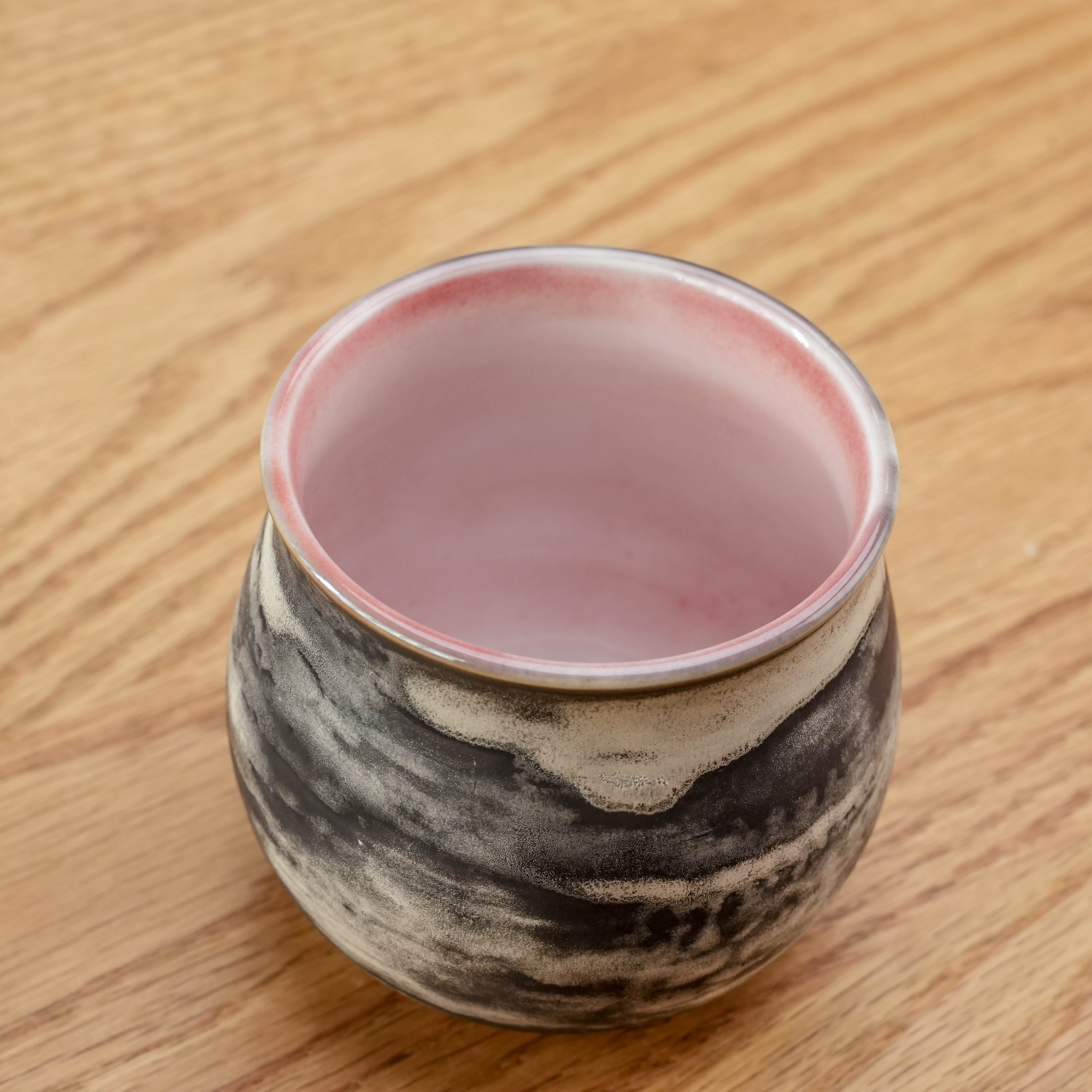 Top view of the Cloudy Evening Cup showing its pink glazed interior and rounded ceramic form, perfect for aroma-rich coffee experiences.